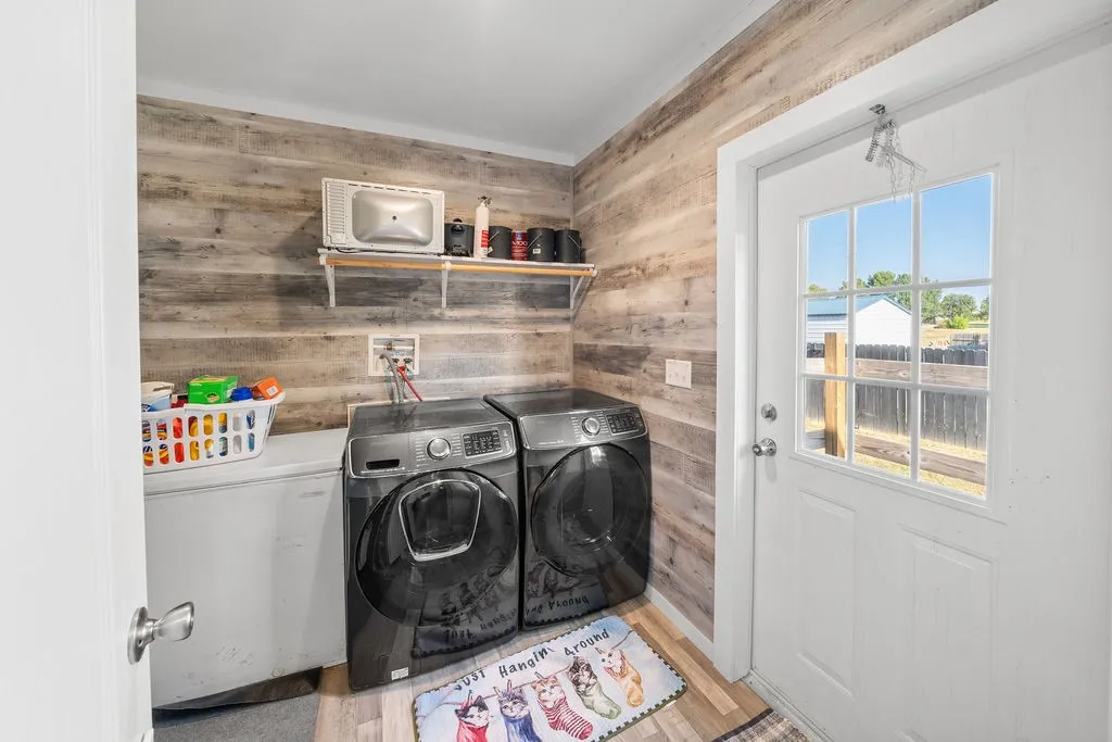 Wood-finish accent wall with open shelving, paired with wood-finish flooring