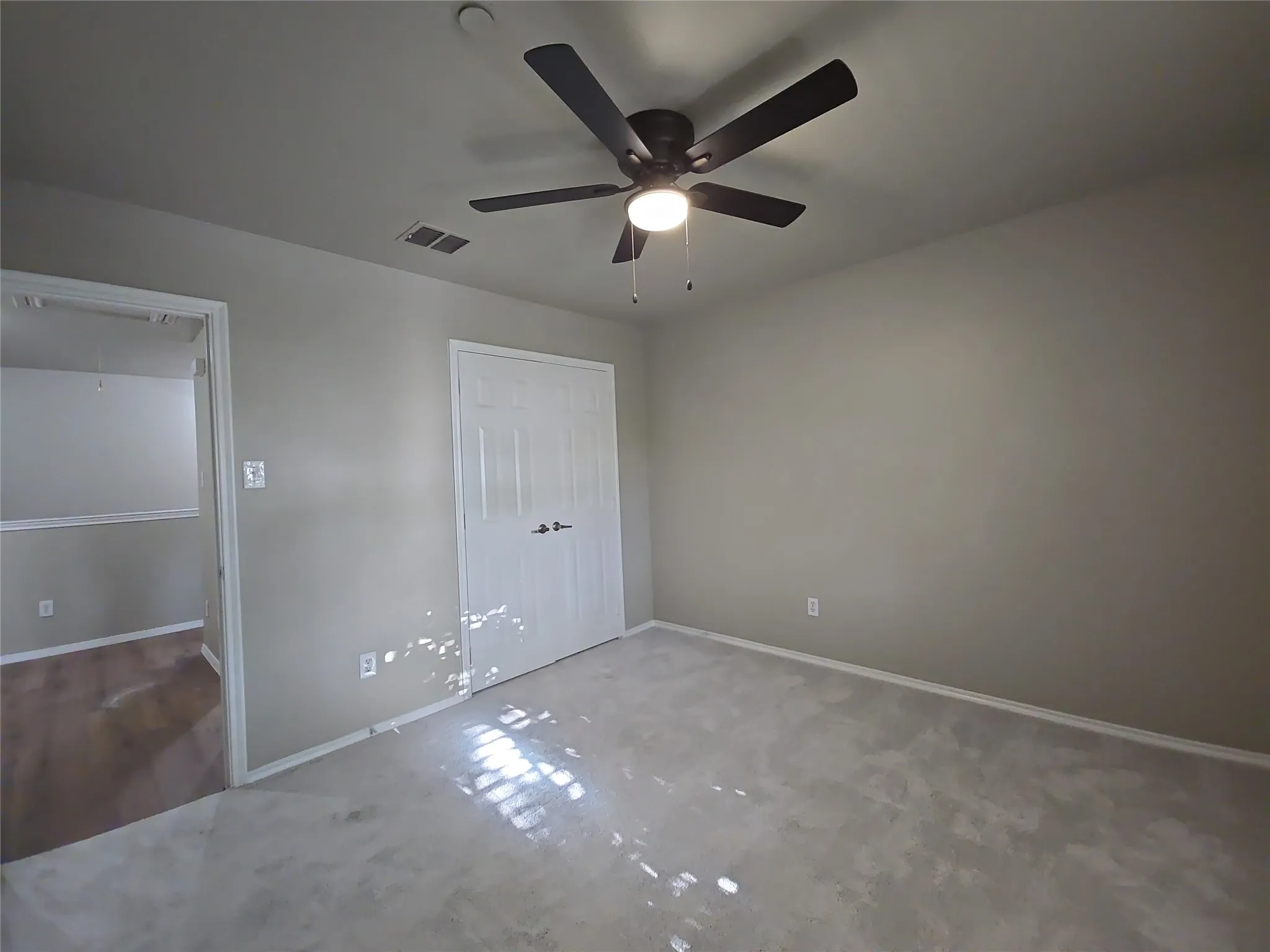 Recessed lighting, ceiling fan with light fixture, light gray carpeting, and white trim