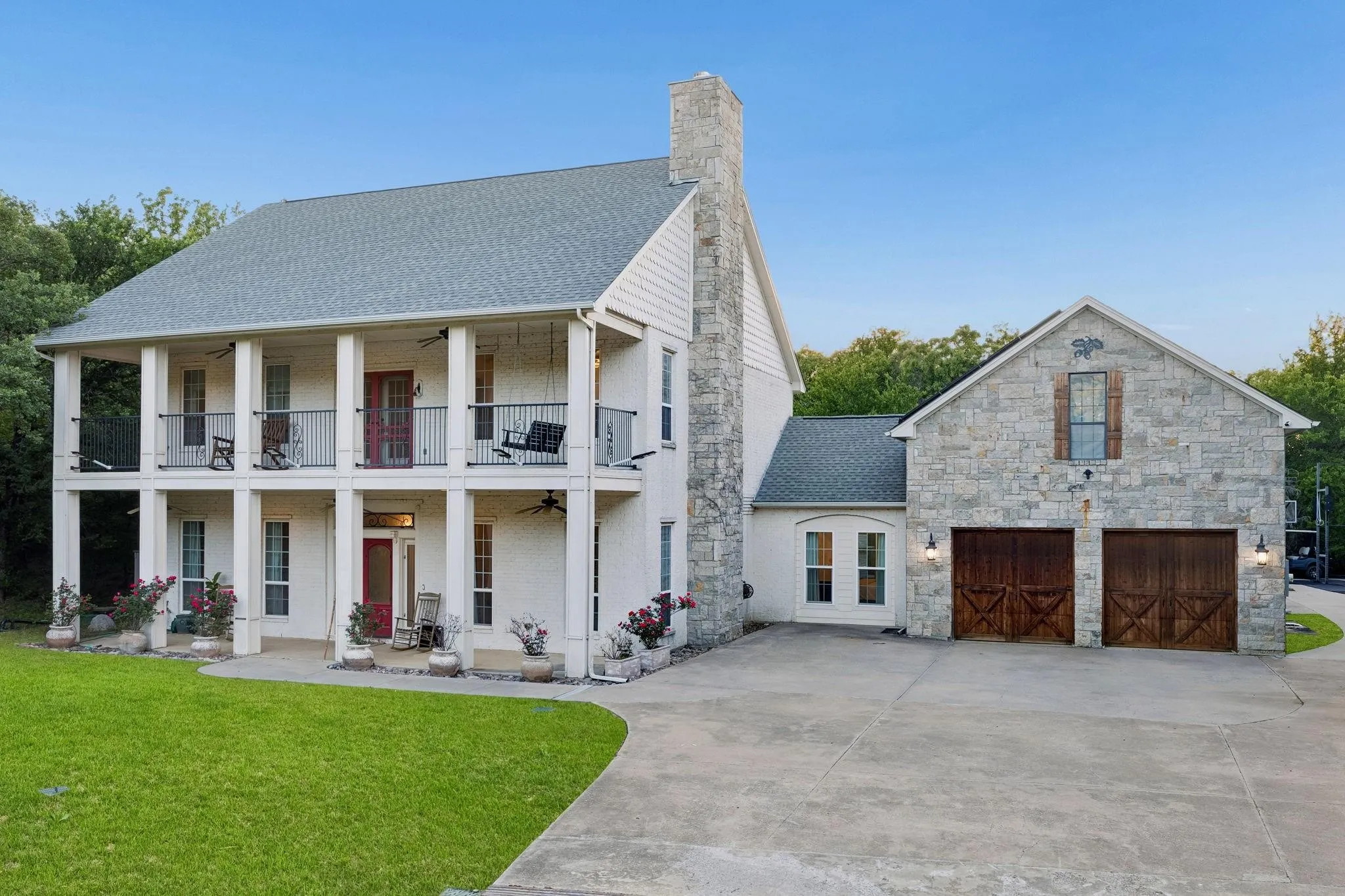 Oversized four-car garage provides abundant space for vehicles, storage, and recreational equipment