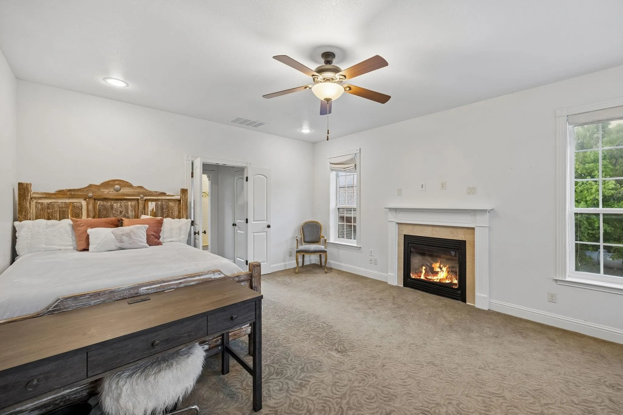 Generously sized upstairs bedroom offering the comfort and privacy of a second primary suite