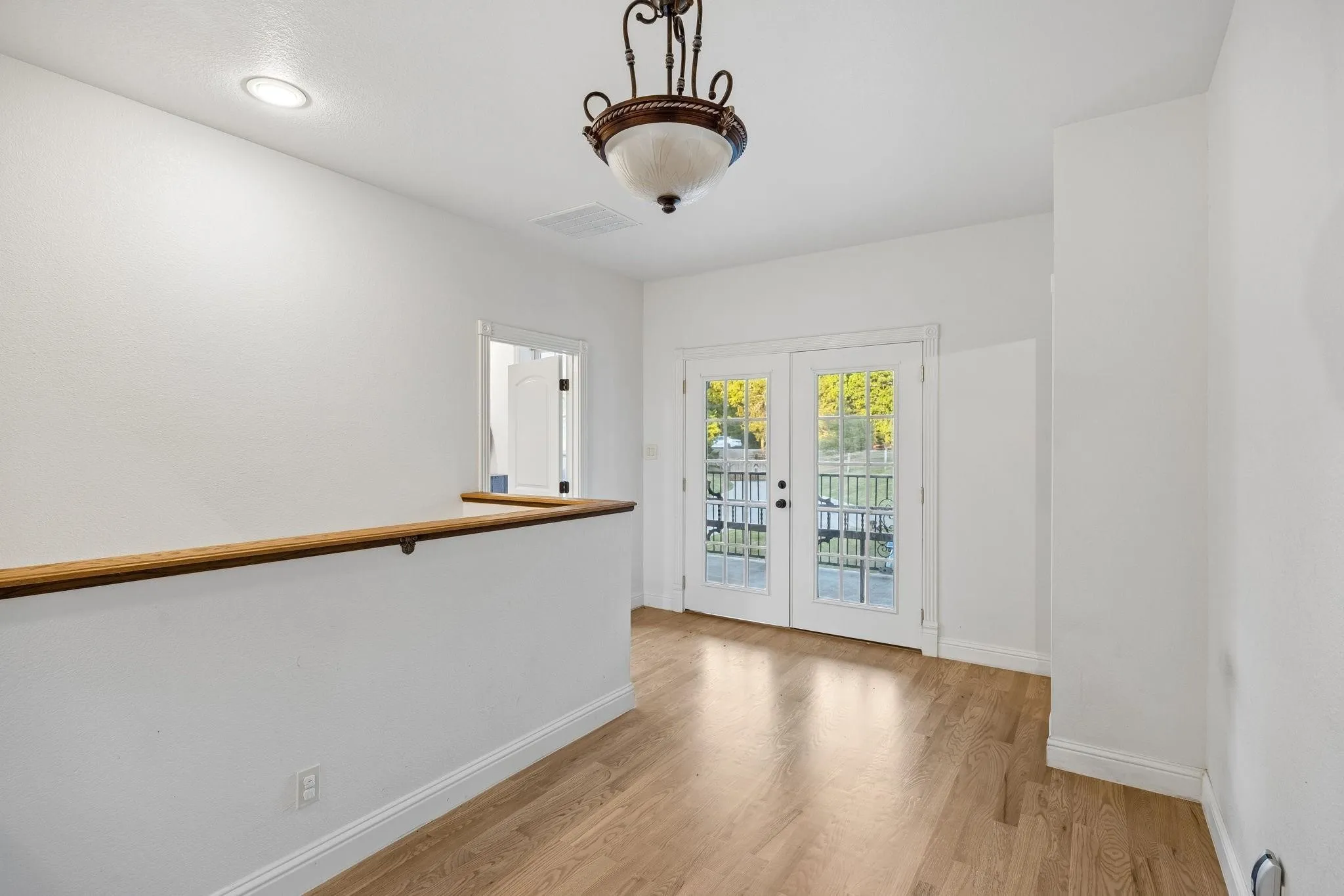 Upstairs Landing with wood flooring