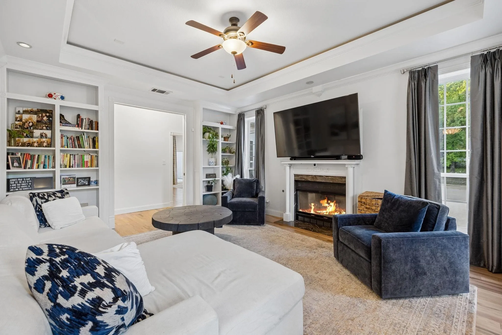 Warm and inviting living space centered around one of three fireplaces, perfect for everyday living and entertaining.