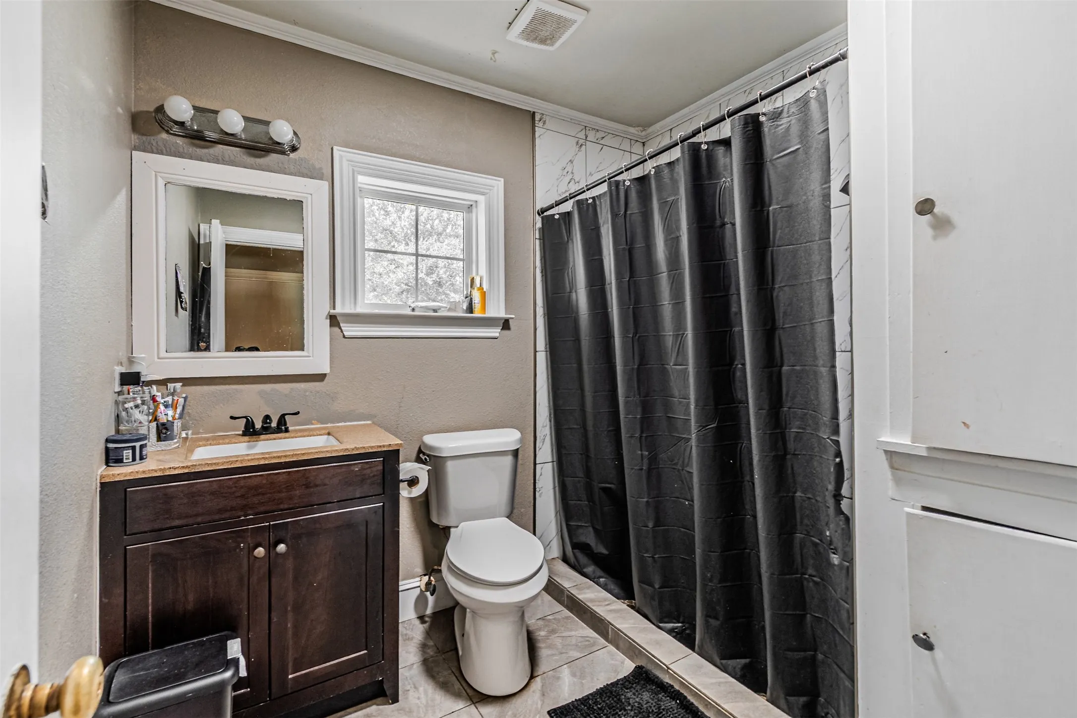 Wood-finish vanity with an integrated sink and countertop