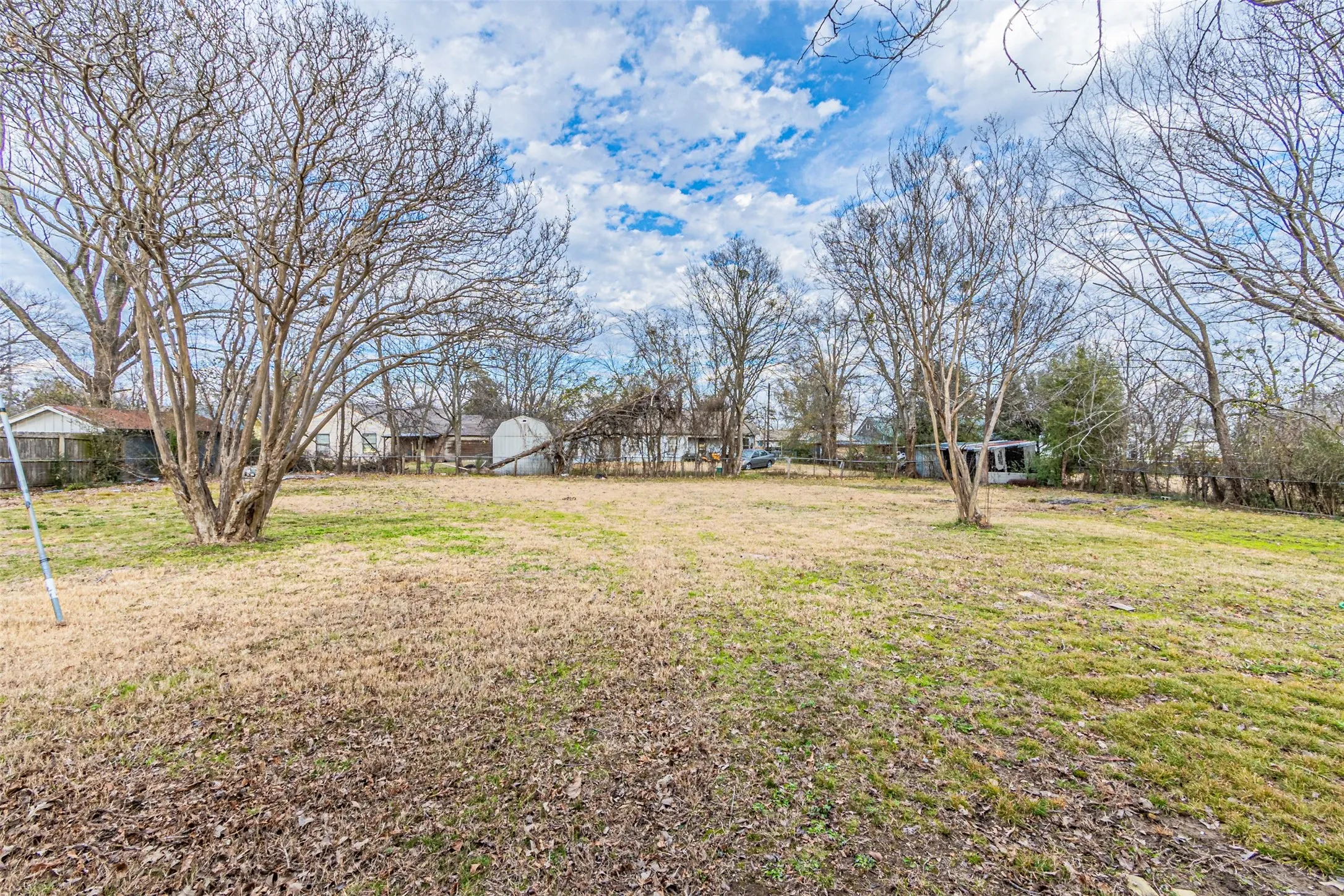 Expansive land parcel featuring existing trees