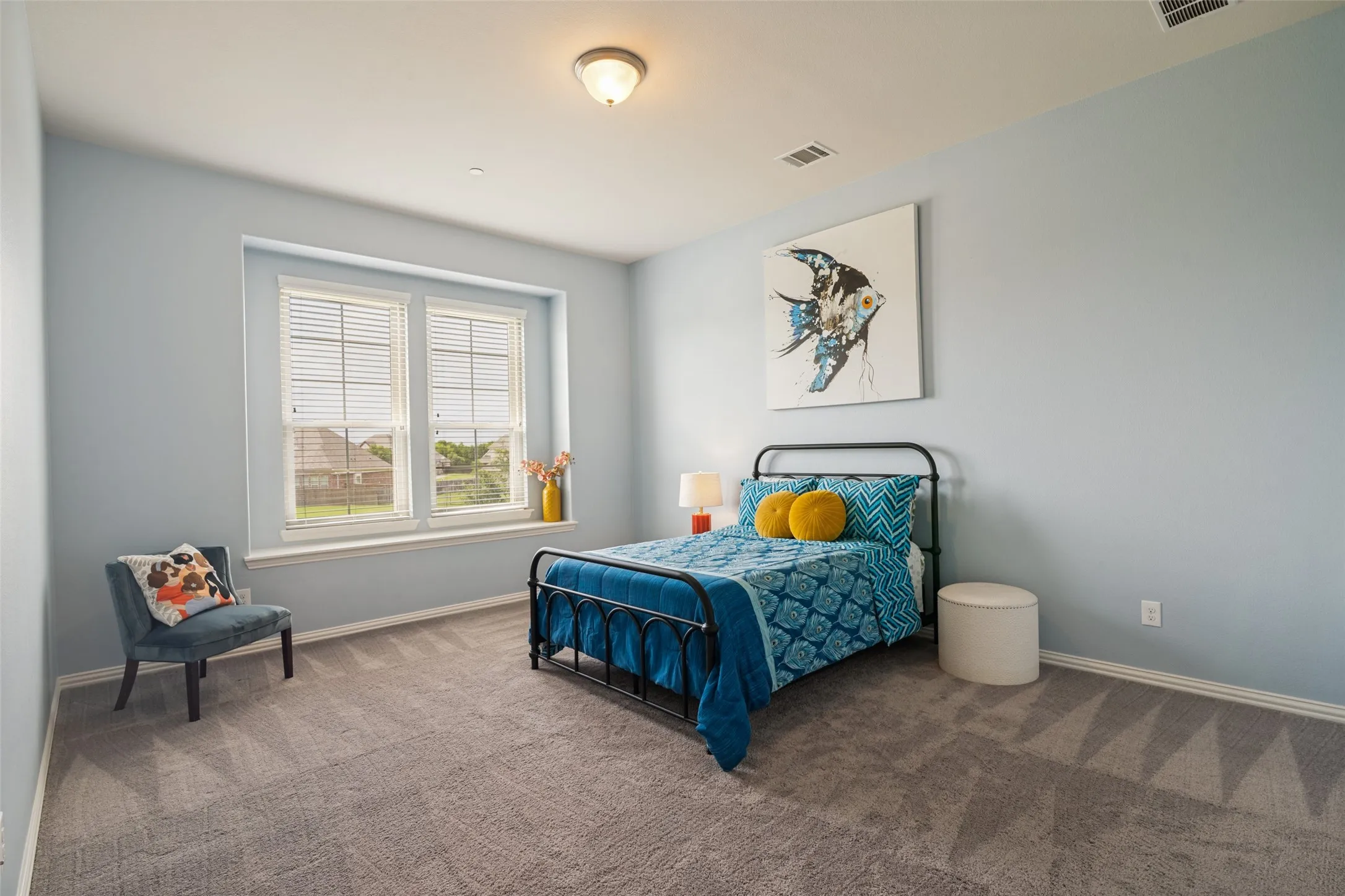 Recessed window with two large windows, overhead flush mount light fixture, and patterned carpet