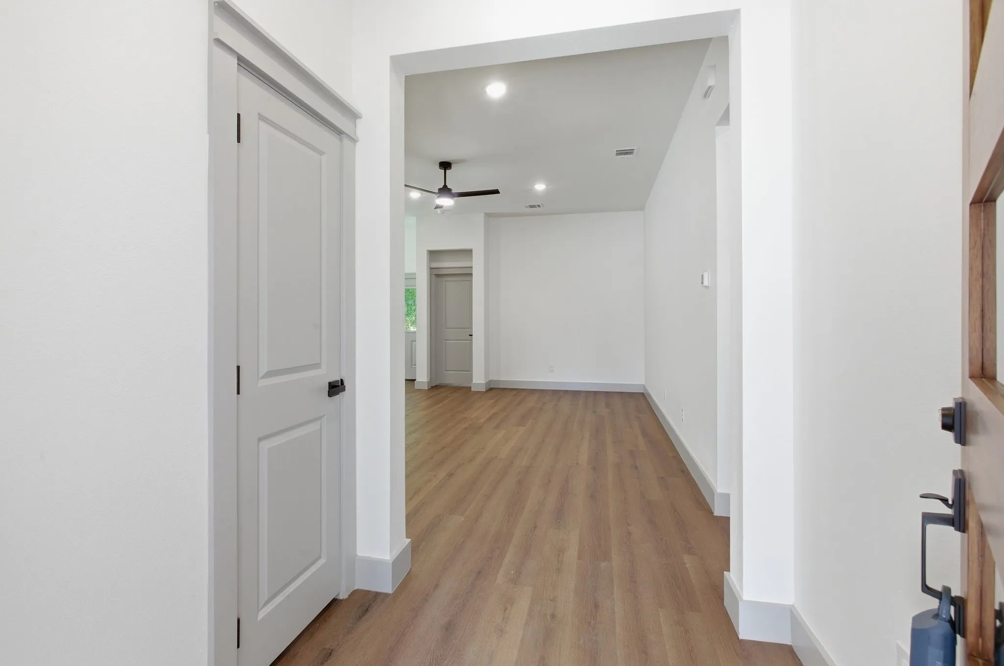 Entryway featuring wood-finish flooring, recessed lighting, and a modern ceiling fan
