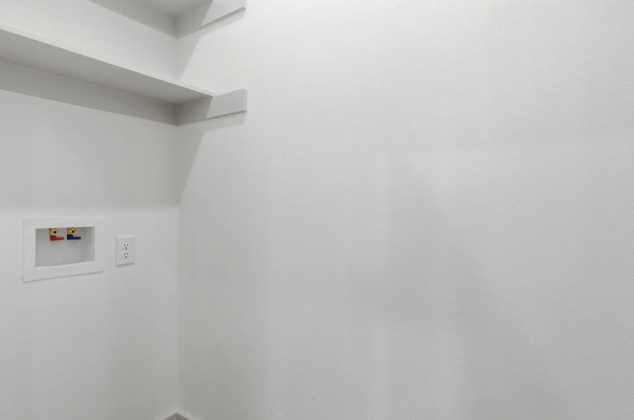 Utility hookups with built-in shelving