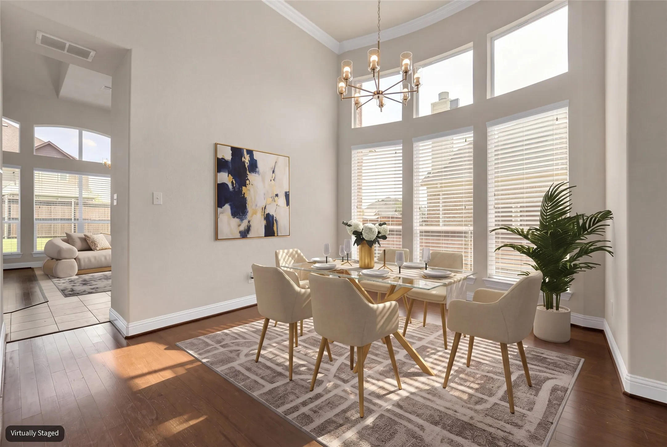 High ceilings and abundant natural light illuminate the wood-finish flooring