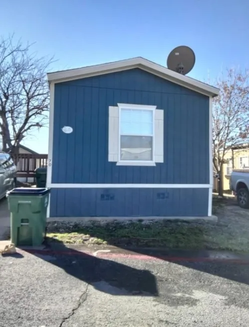 Blue vertical siding exterior with white trim