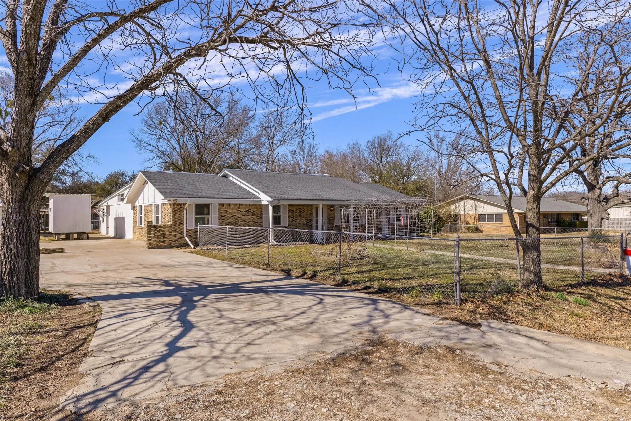 Brick and siding exterior with a covered porch
