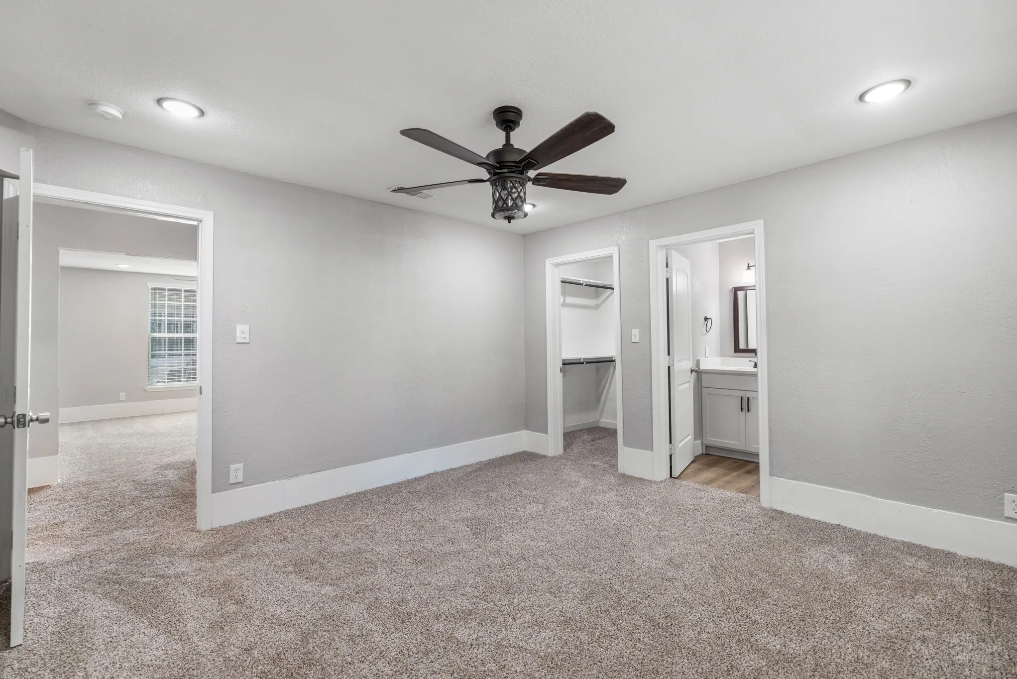 Recessed lighting, ceiling fan, and carpeted flooring