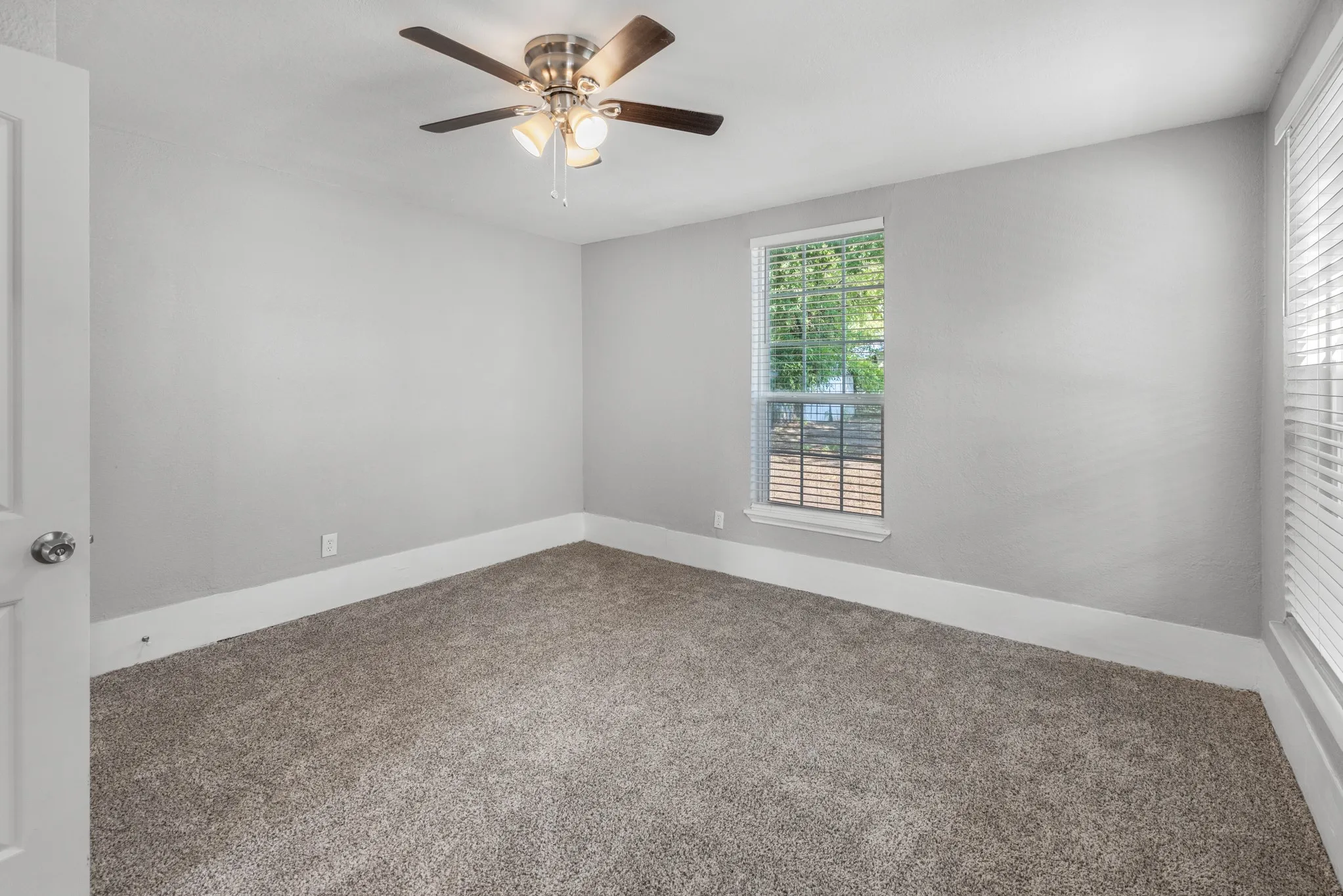 Neutral-toned walls and plush carpeting