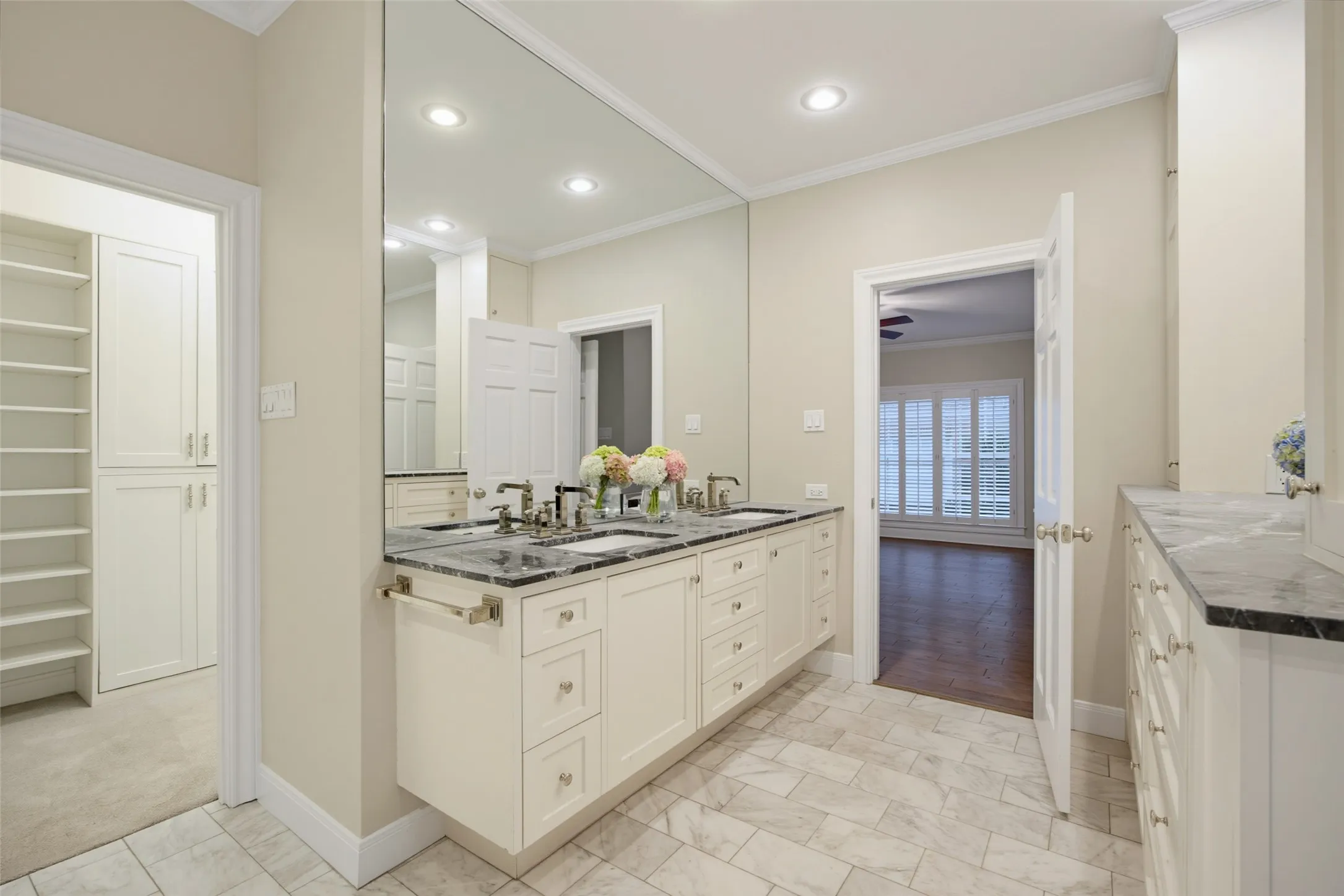 Custom cabinetry and dual sinks with custom faucets.