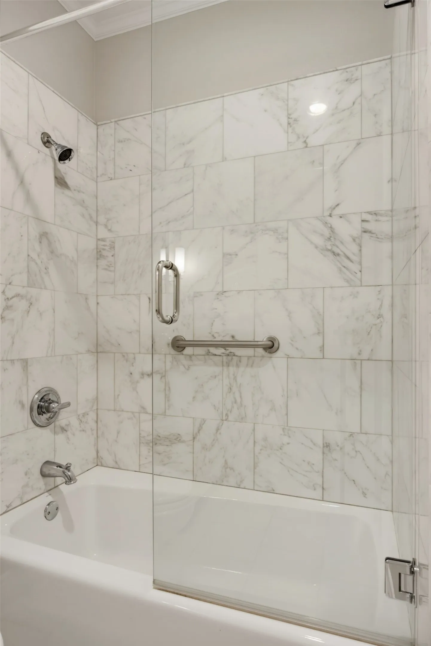 Marble surround for tub/shower serving 2nd bedroom