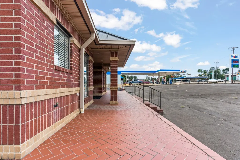 Red brick exterior with light-colored brick banding