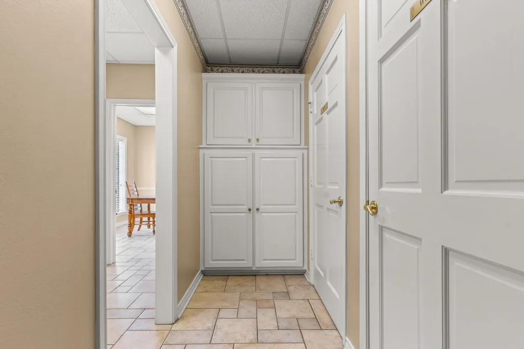 Neutral-toned walls complement the tile flooring