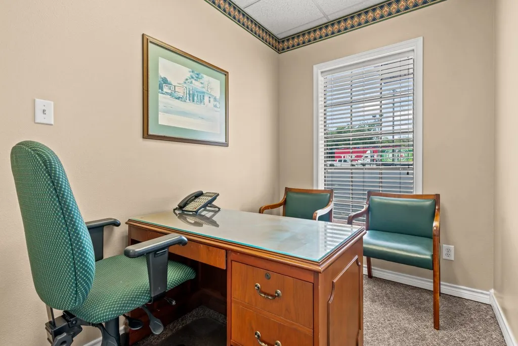 Recessed ceiling, neutral wall paint, window with blinds, and carpeting