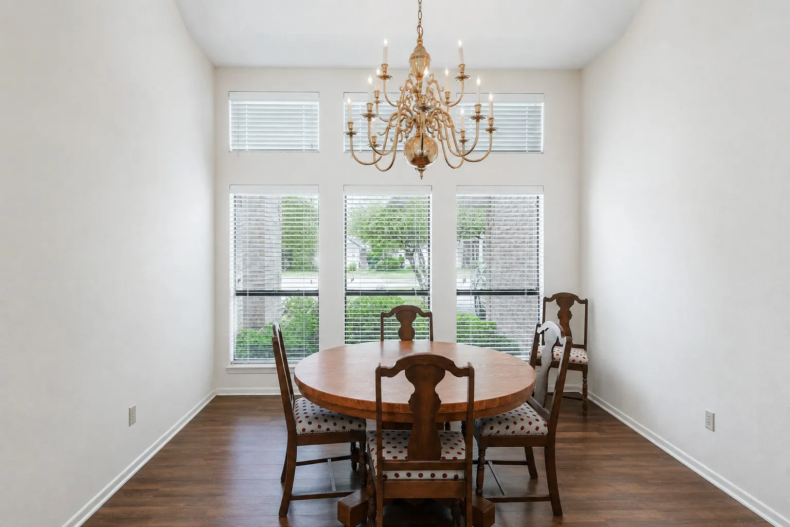 Large formal dining room with floor to ceiling windows