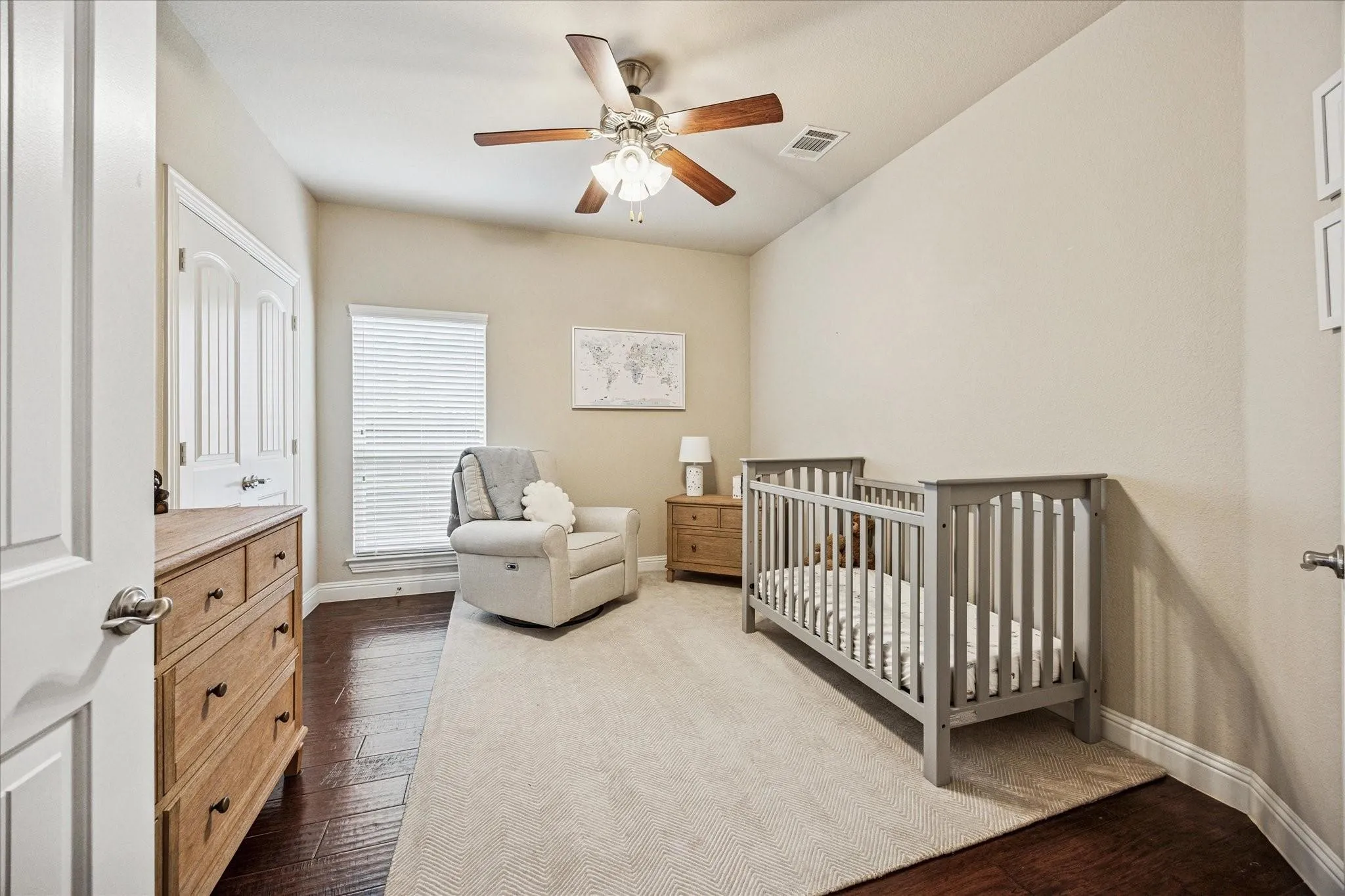 Recessed lighting, wood-finish flooring, ceiling fan with integrated lighting, window with blinds, and paneled interior door