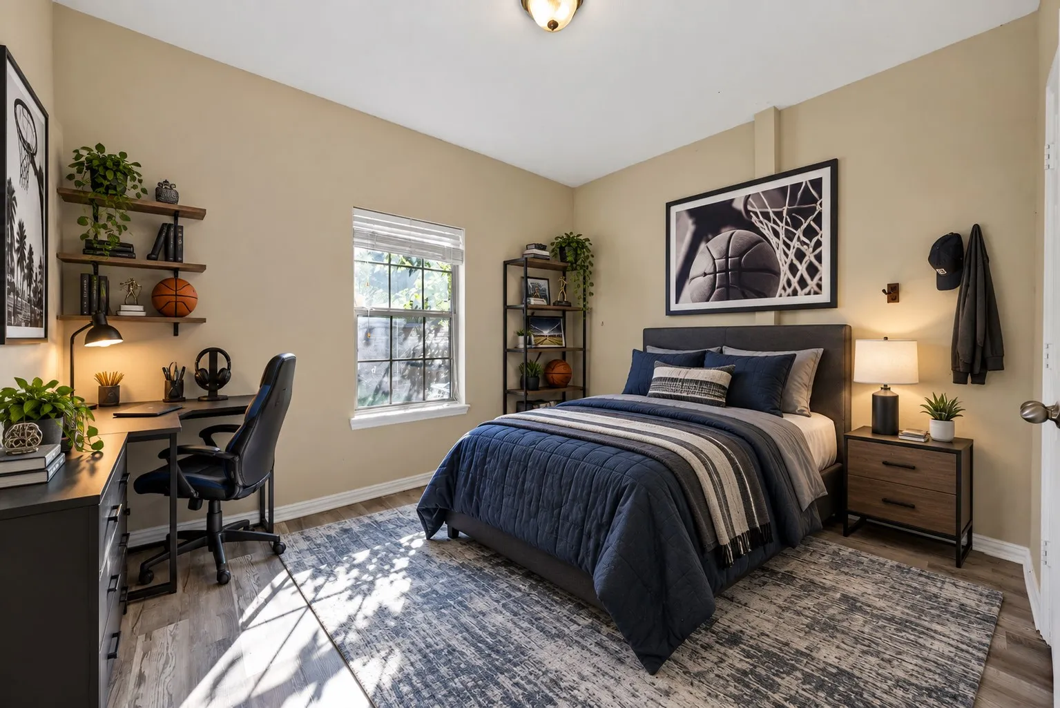 Virtually staged downstairs primary bedroom Wood-look flooring, ceiling light, and a window with natural light. Separate full bath located nearby on the main level.