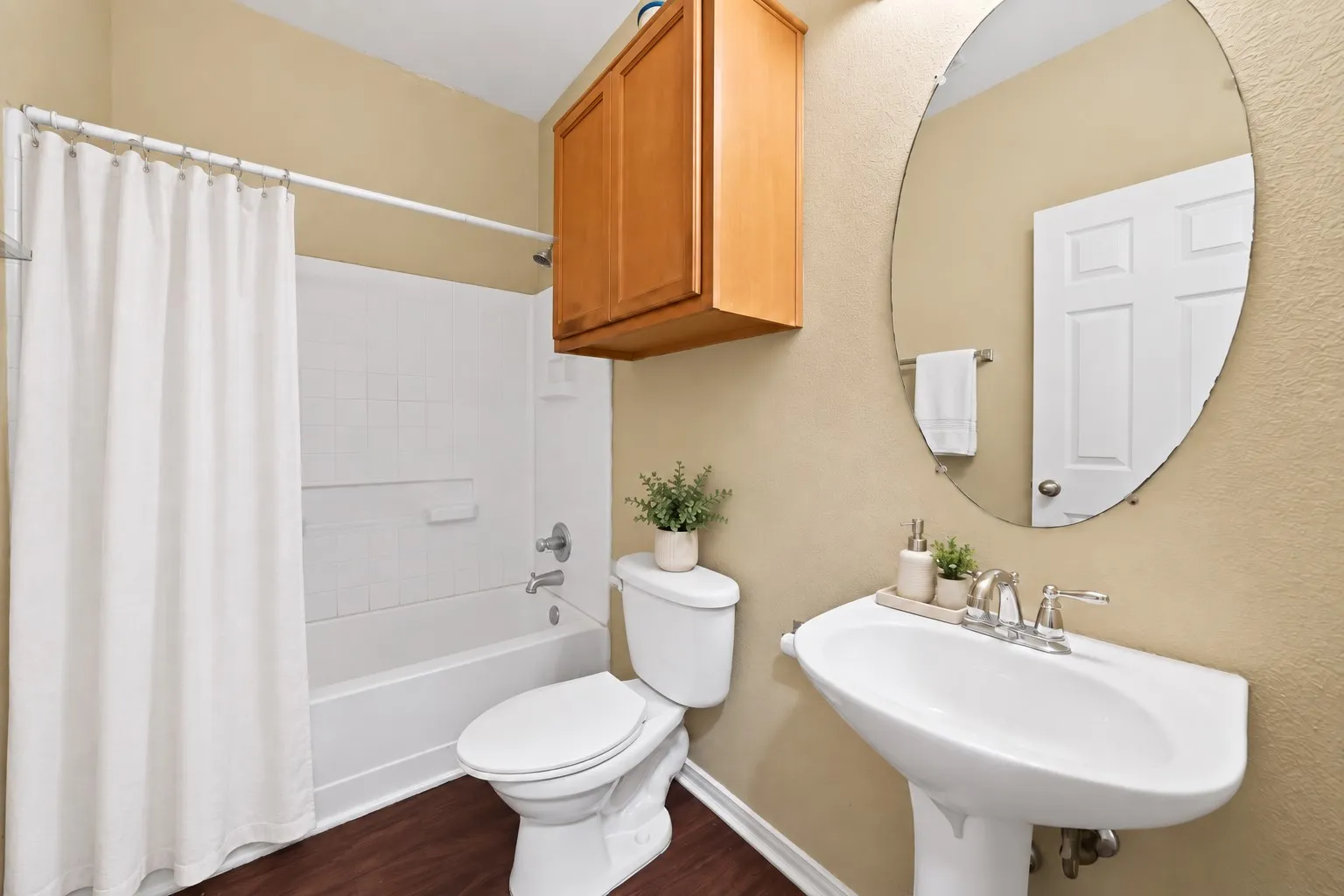 Downstairs full bathroom adjacent to the primary bedroom.