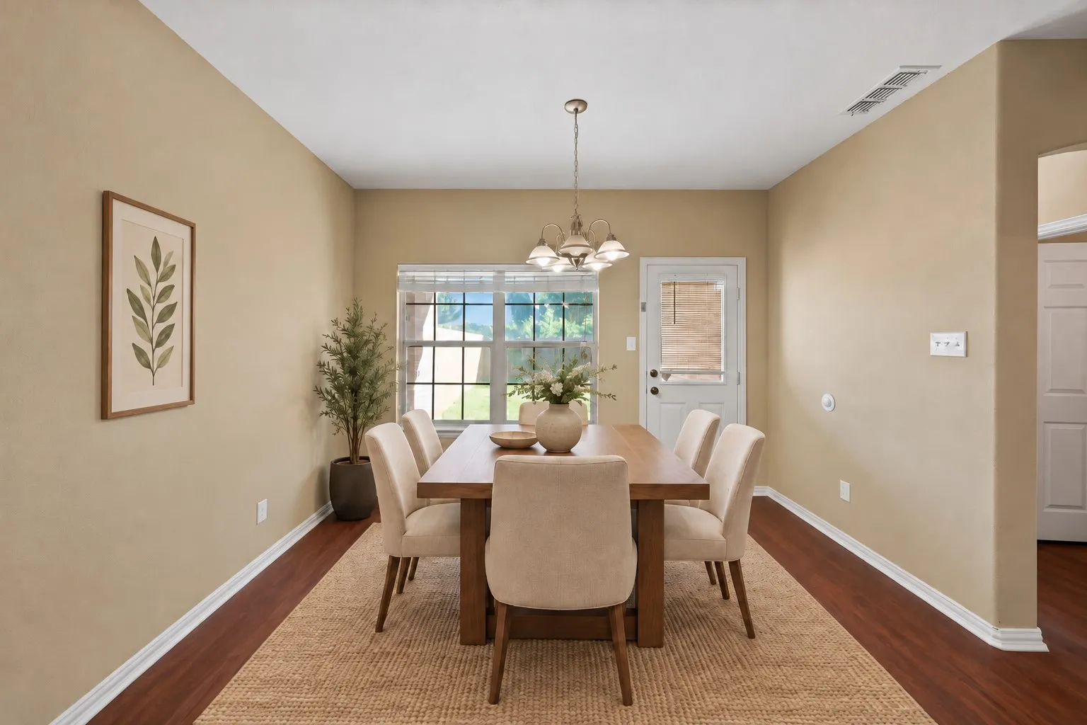 Dining area: Pendant chandelier and a double window overlooking the backyard. Half-glass door with built-in blinds leads to the back yard - virtually staged