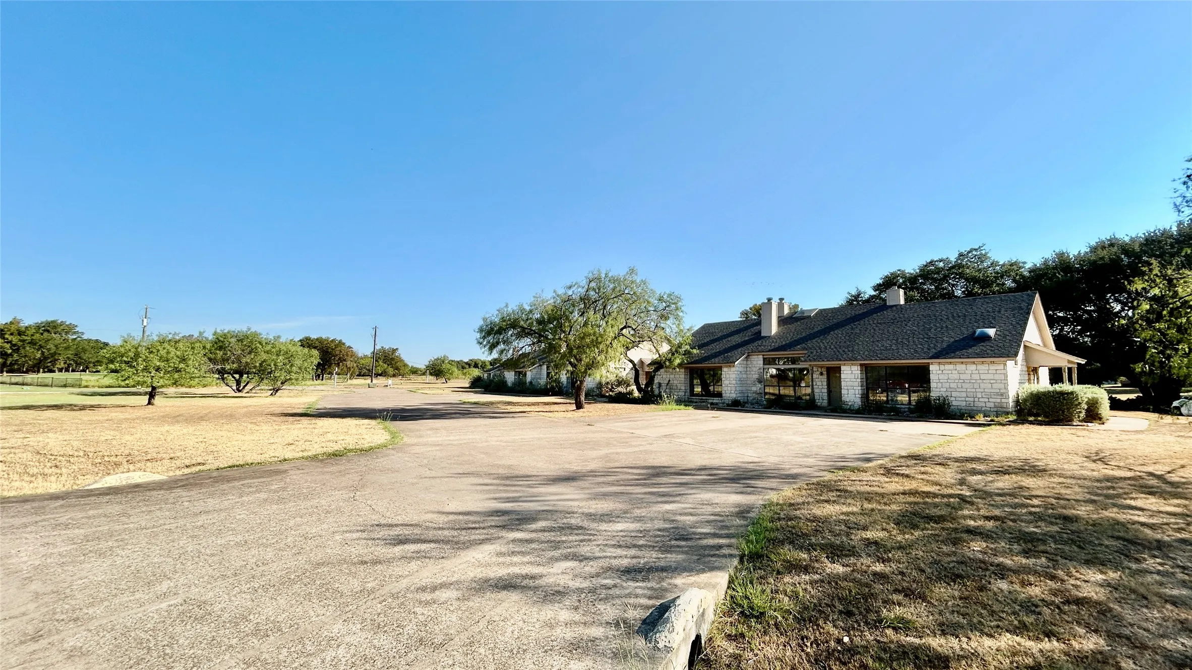 Property is 1.95 Acres and has a golf course view in back.