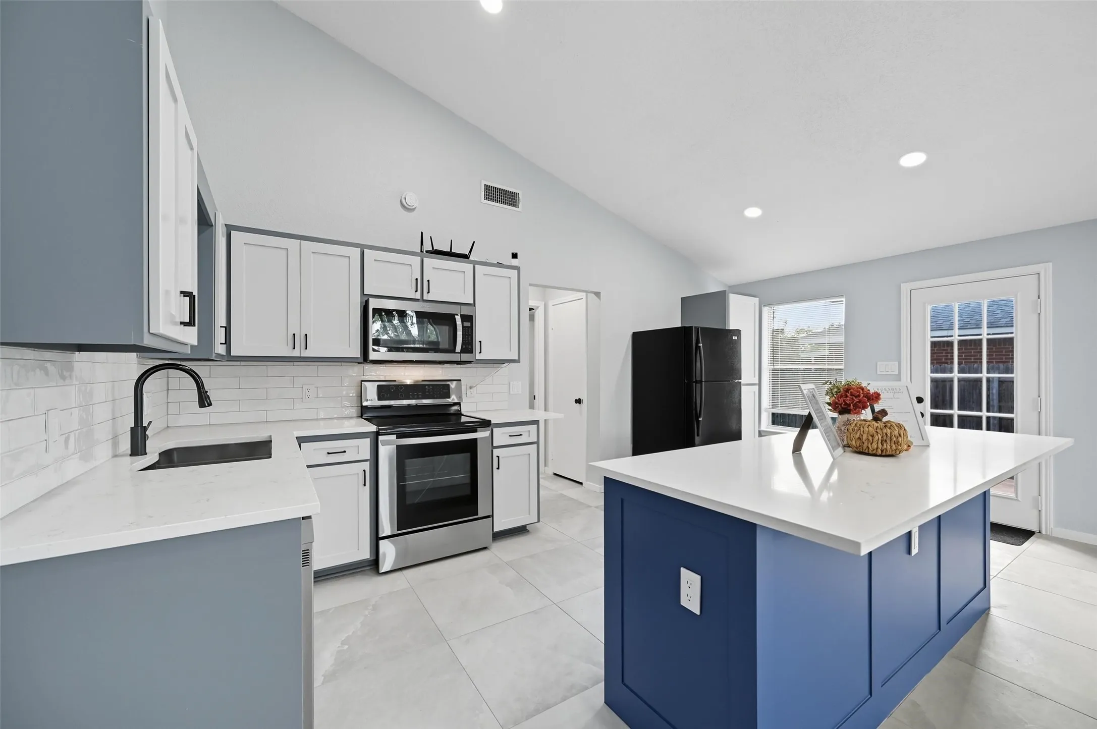 BRAND NEW REMOLDED AND UPGRADED KITCHEN with a large island creating ample space for entertaining!