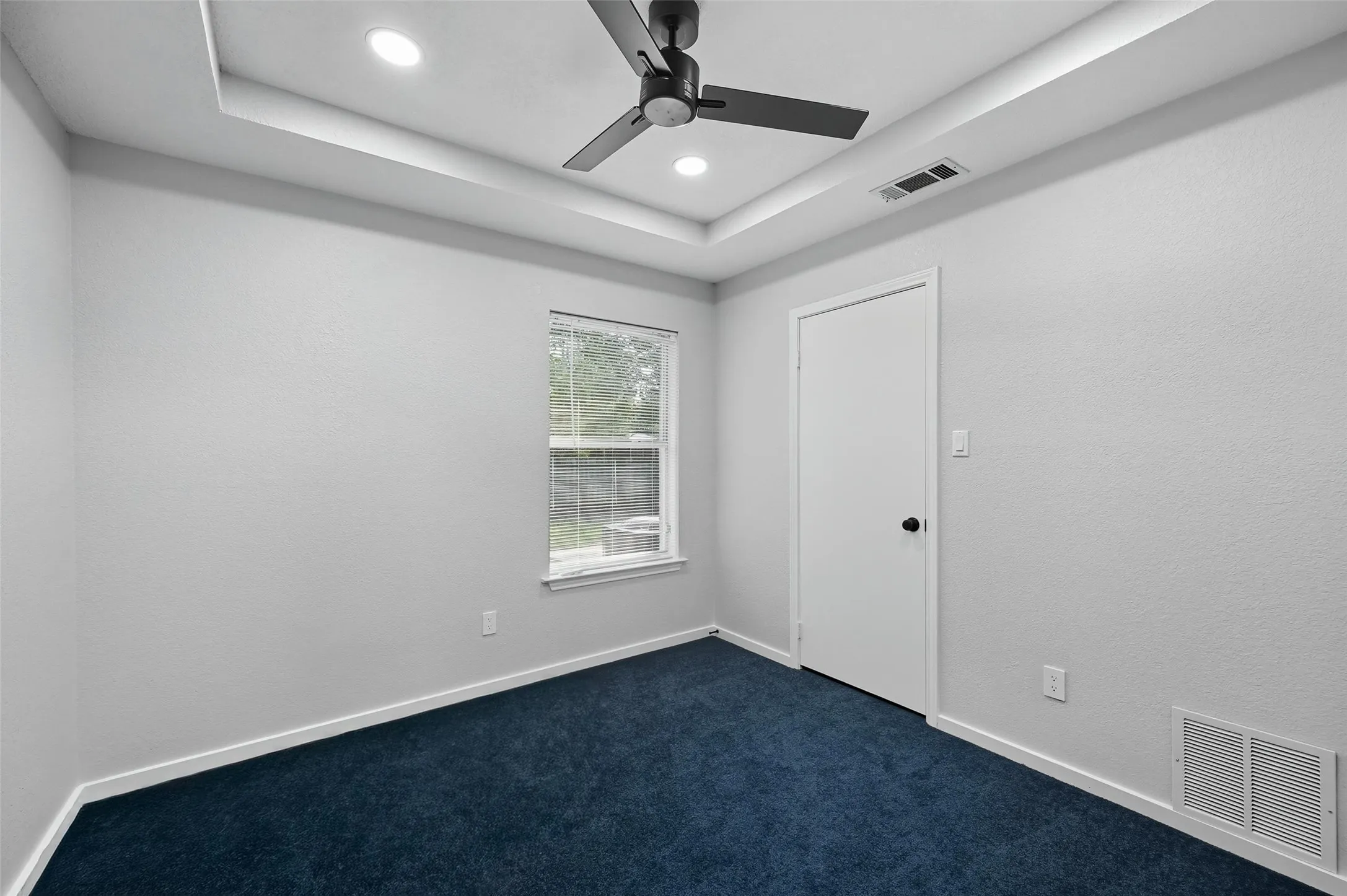 Secondary Bedroom 2 includes fresh paint, carpet, ample closet, recessed dimmable lighting, fan and window coverings.