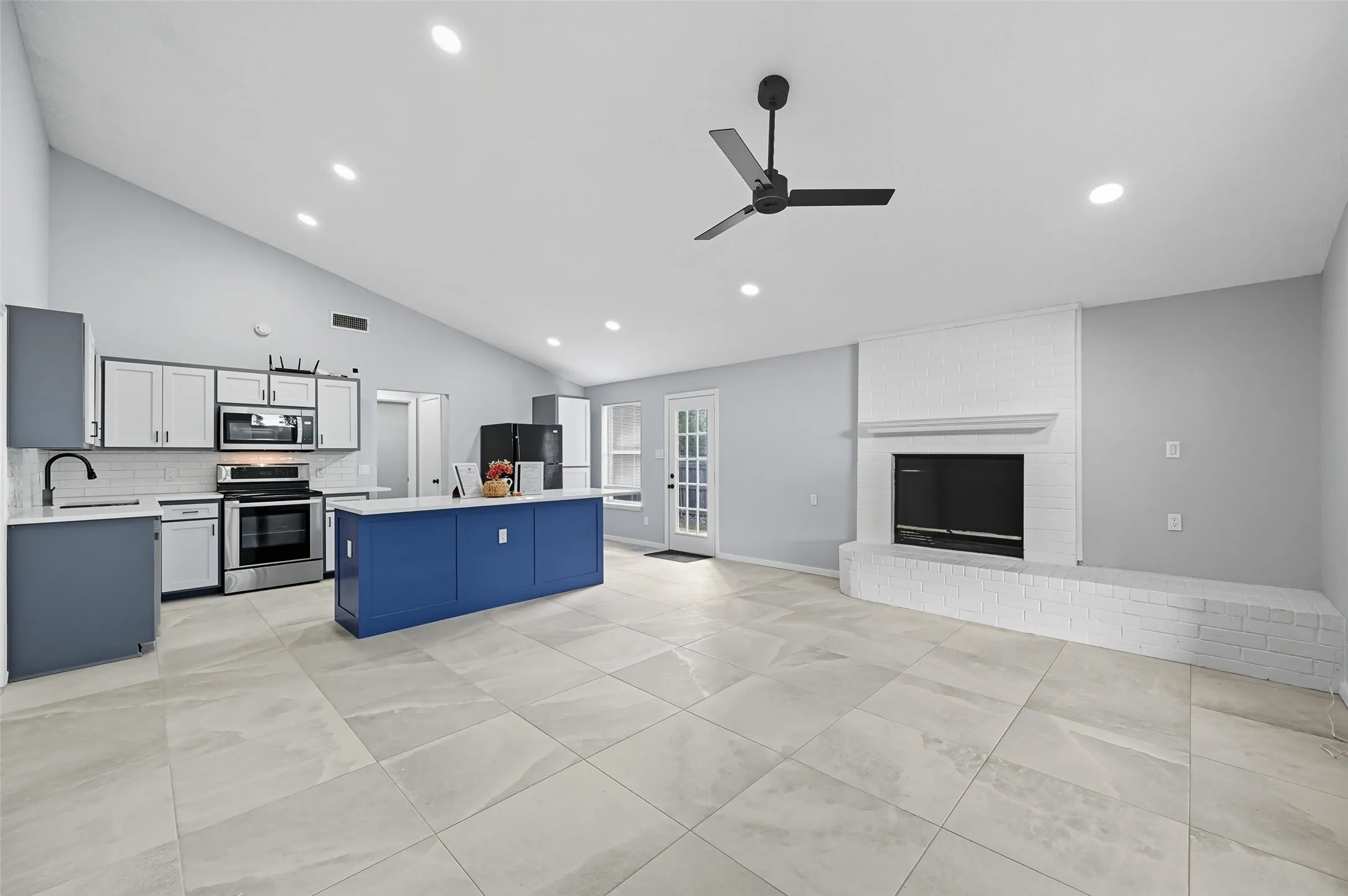 TOTALLY remolded home, open concept living, new flooring, fresh paint, high ceilings with recessed dimmable lighting and so much more!