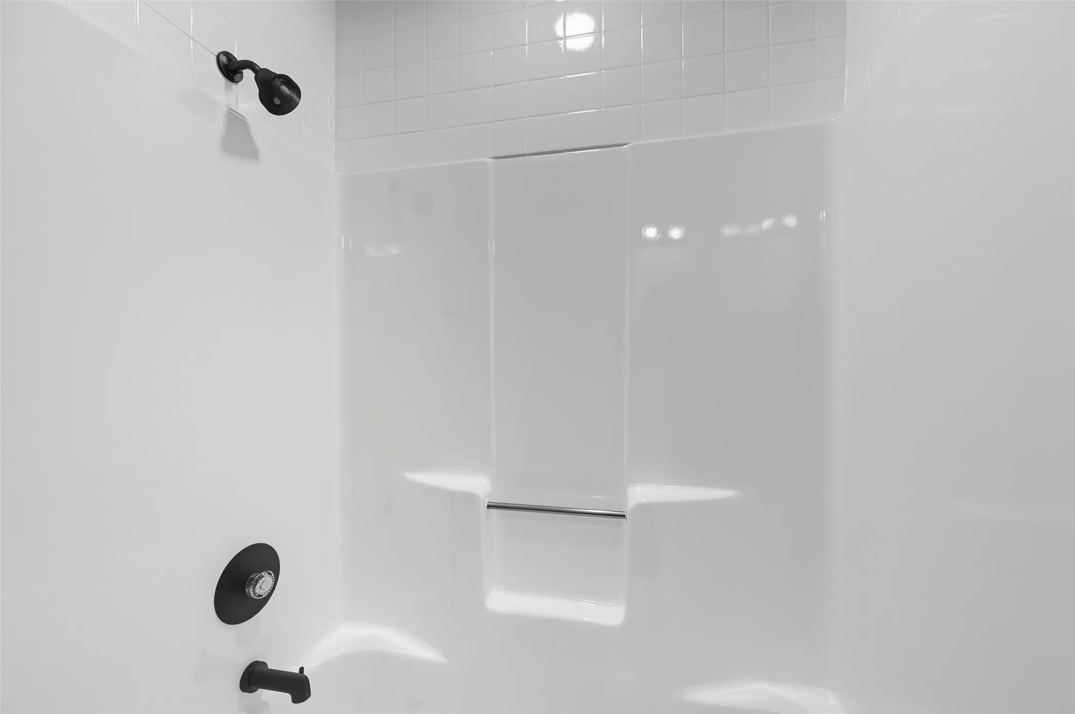 Secondary bathroom with a tub shower combo
