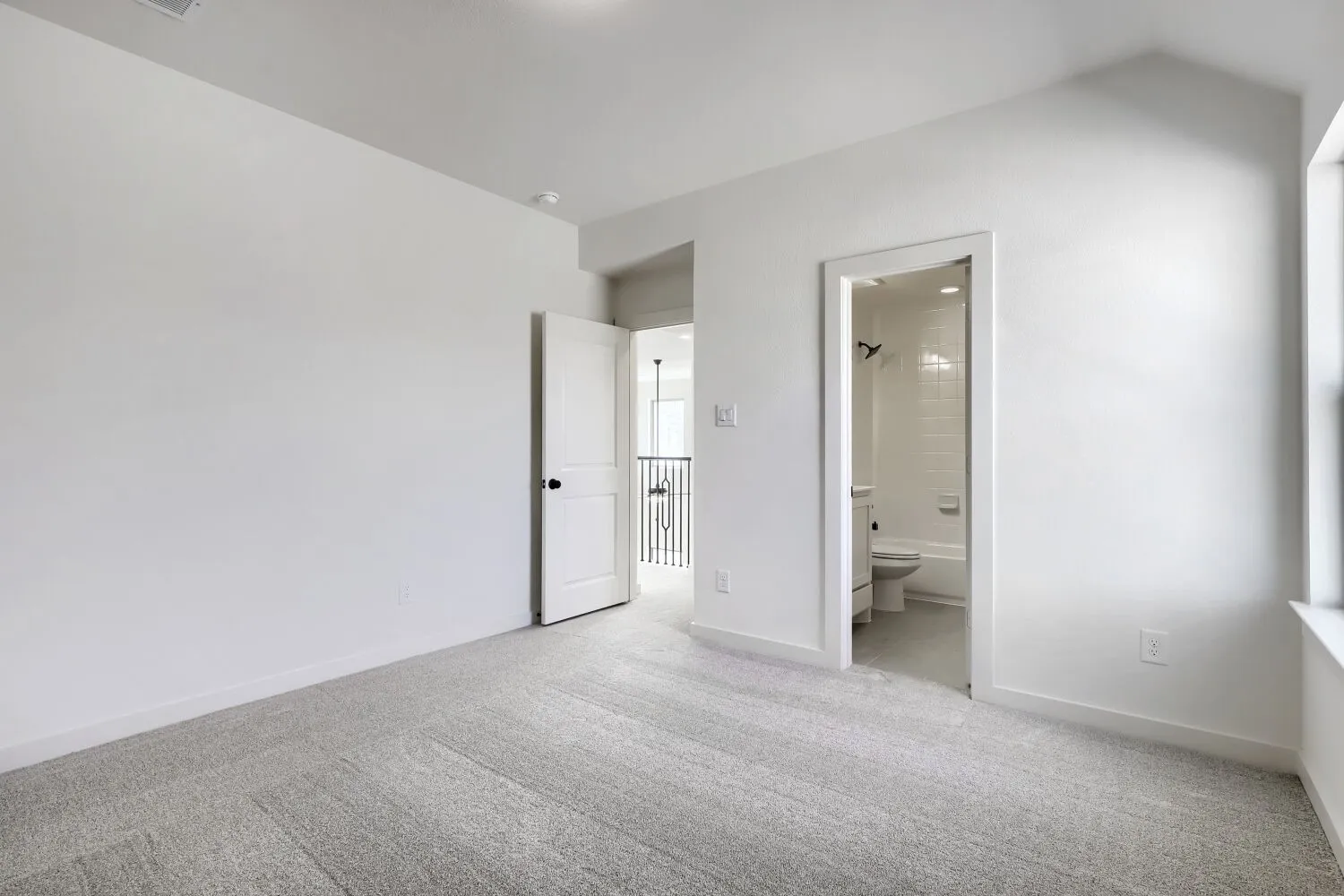 Light grey carpeting with light neutral wall paint