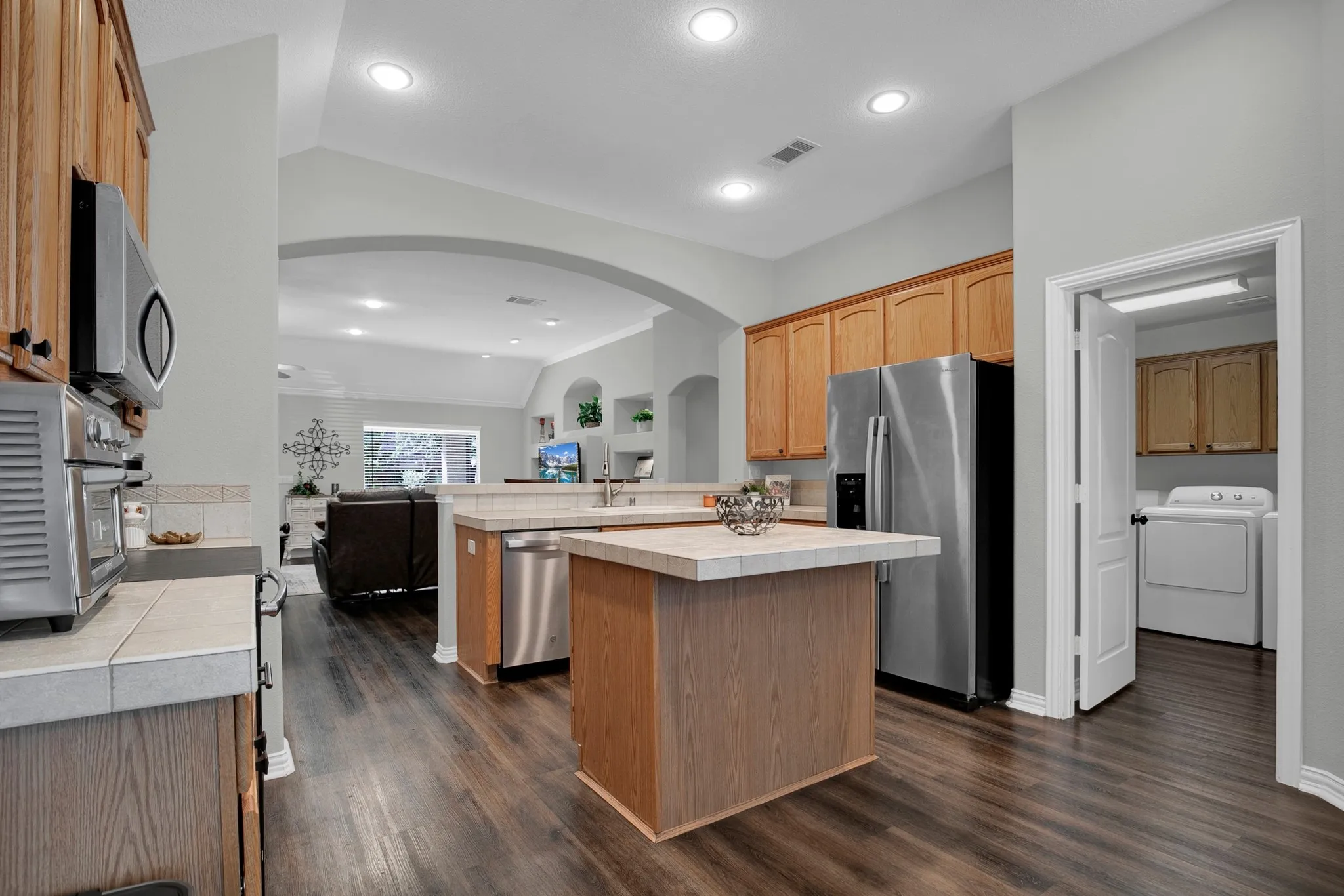 Kitchen featuring wood-finish flooring, recessed lighting, and stainless steel appliances