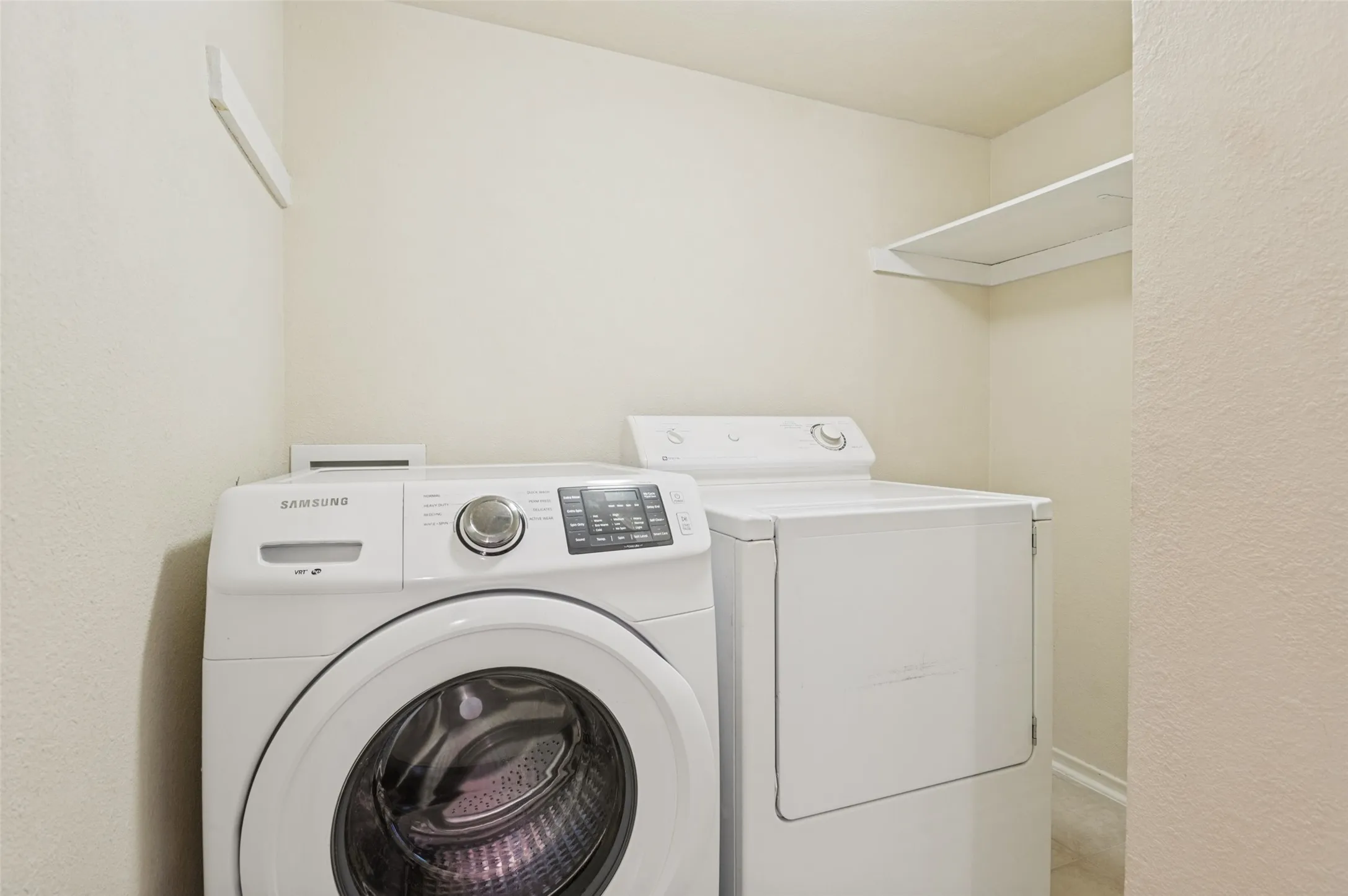 Full size Washer Dryer area
