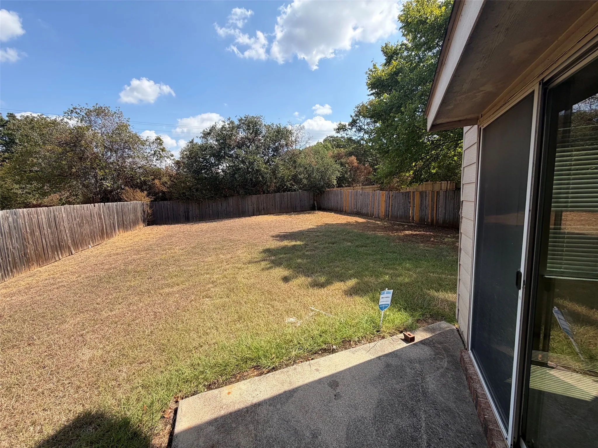 Huge back yard with uncovered patio
