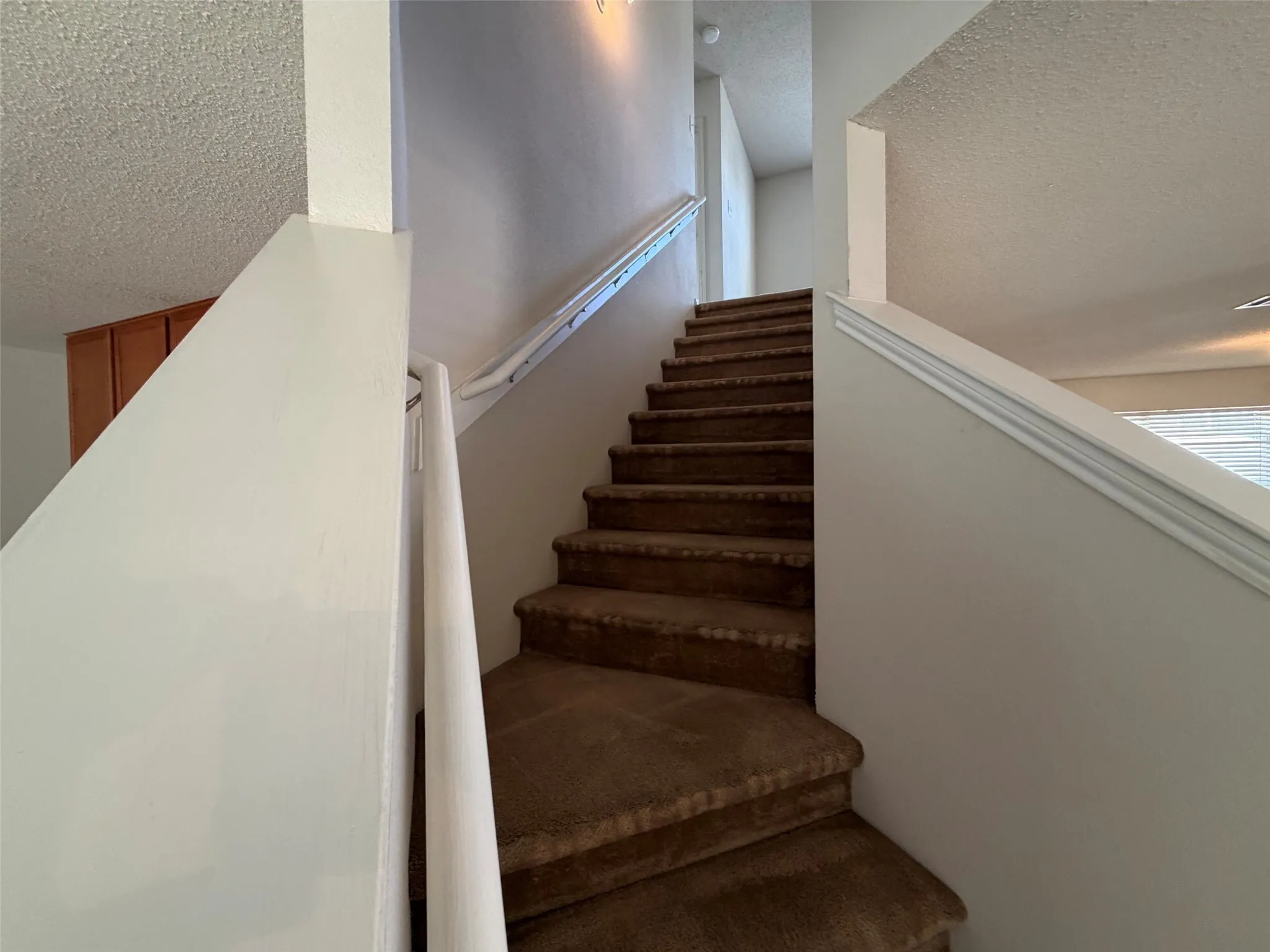 Stairwell to game room and three spacious bedrooms.
