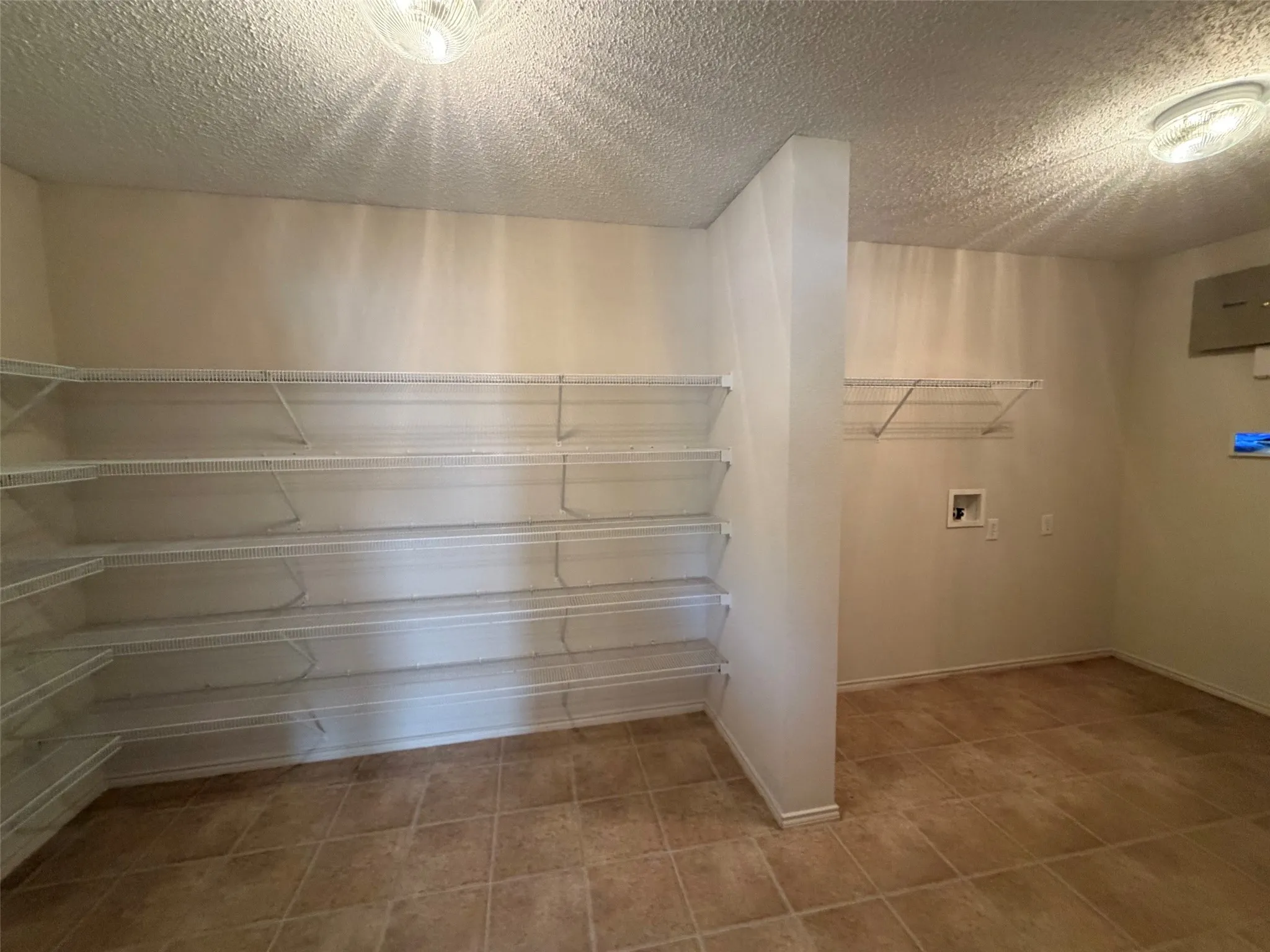 Combination utility room and spacious pantry off kitchen.