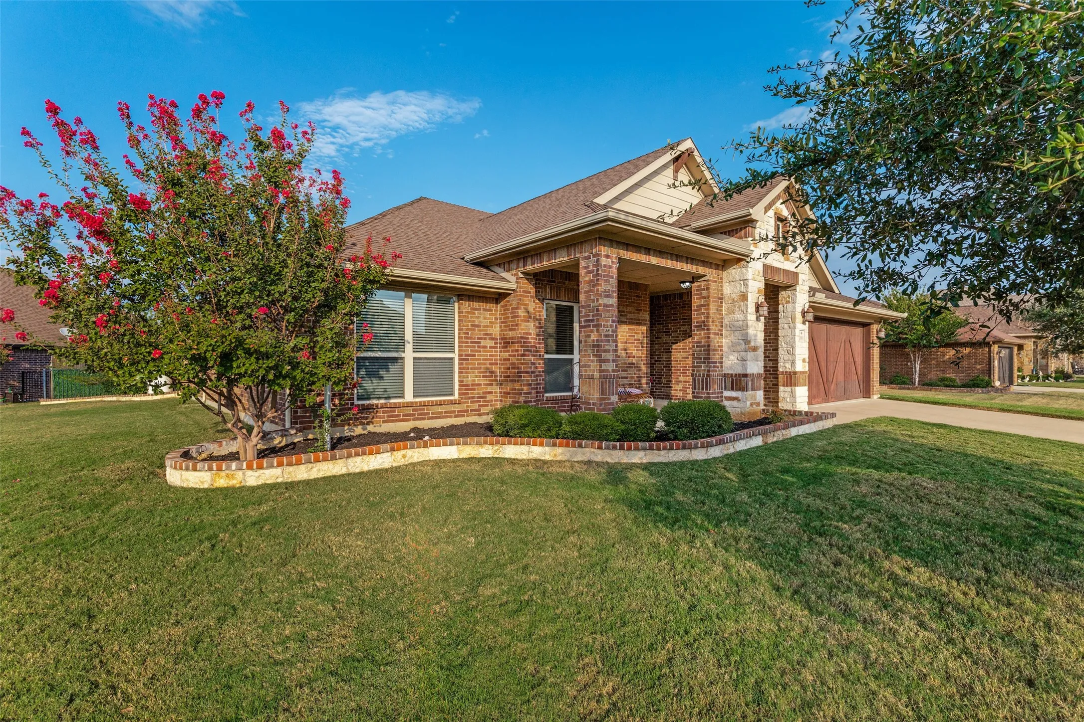 Brick and stone exterior with architectural shingles