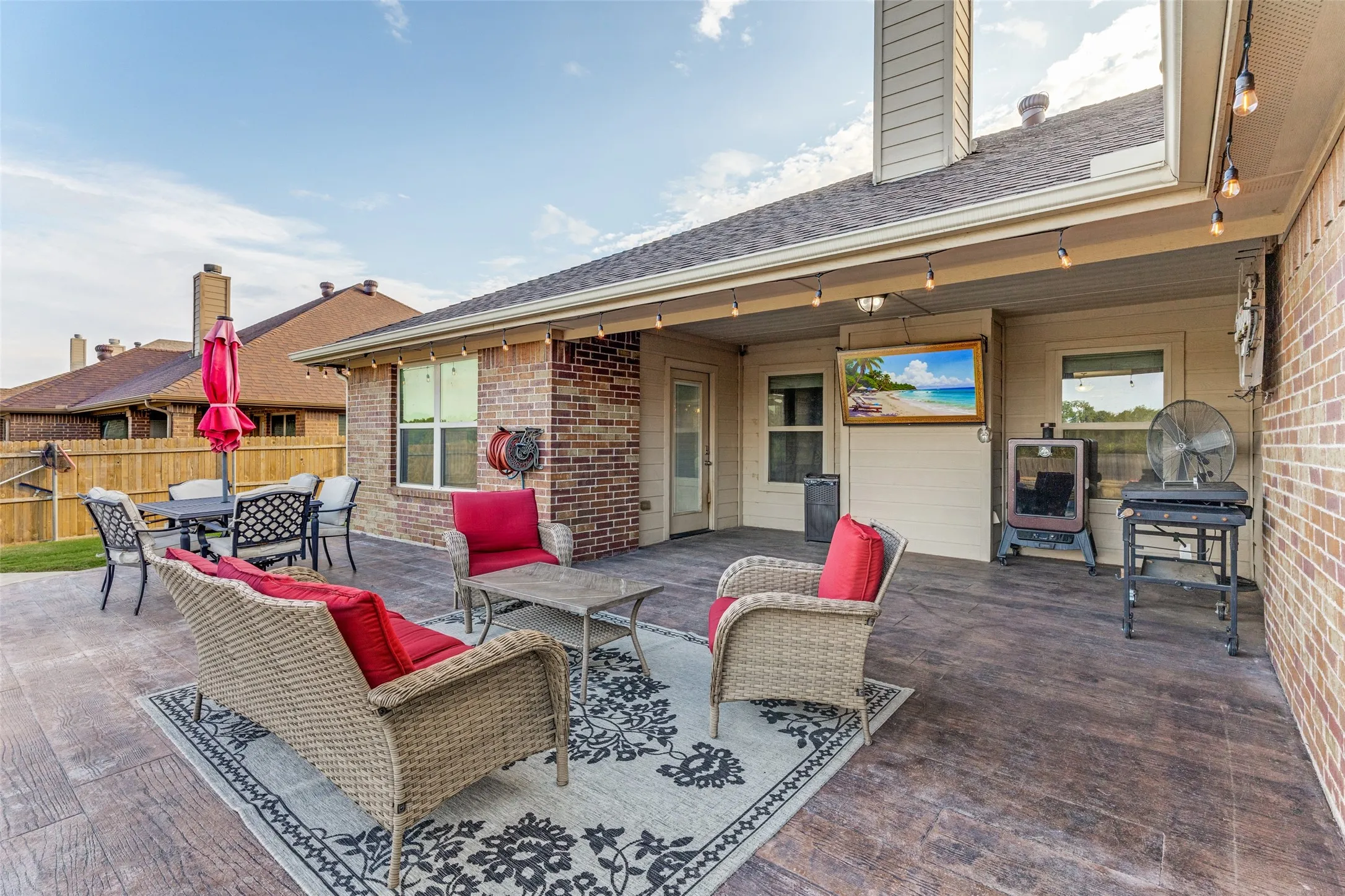 Spacious covered patio with textured concrete flooring