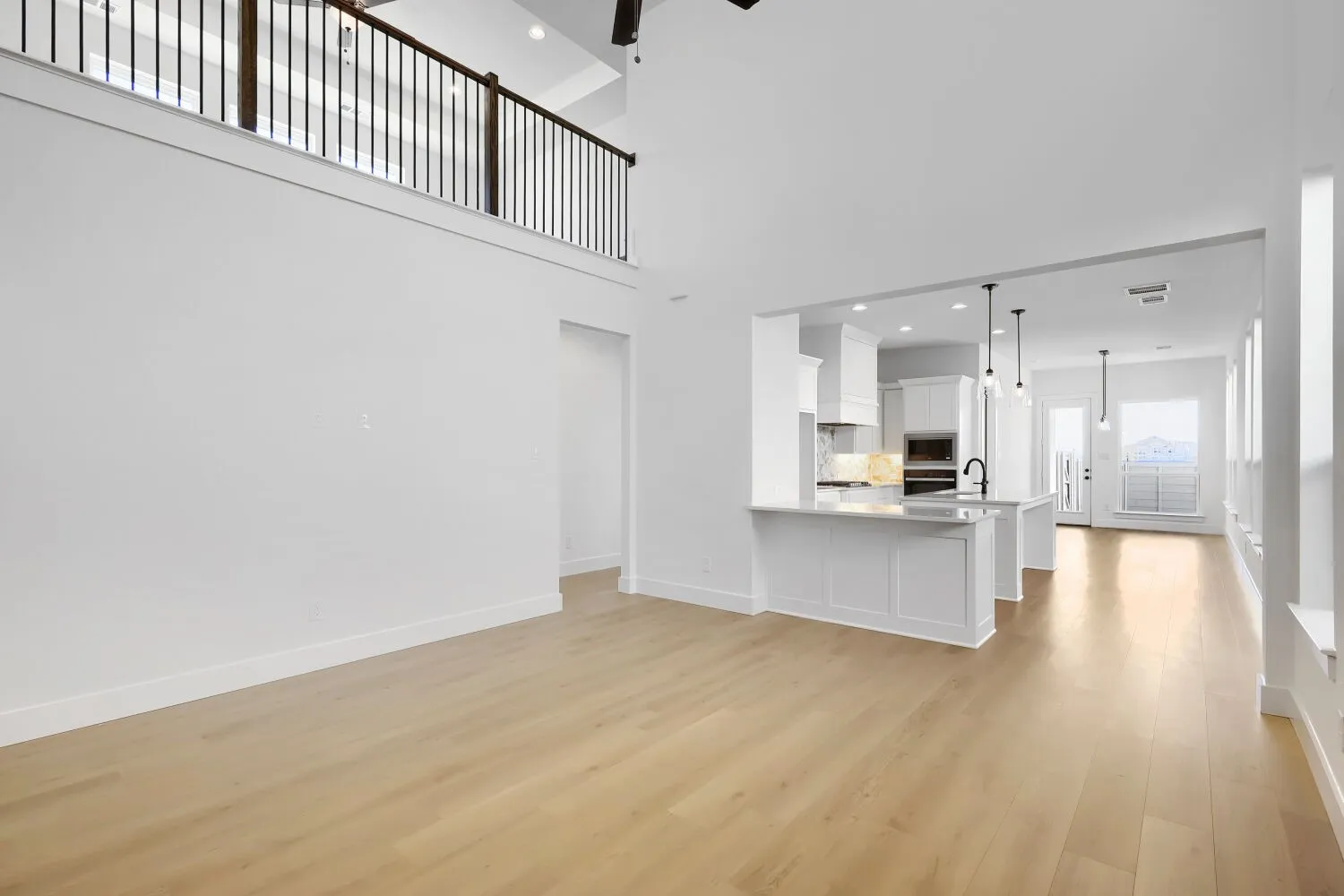 High ceilings with wood-finish flooring