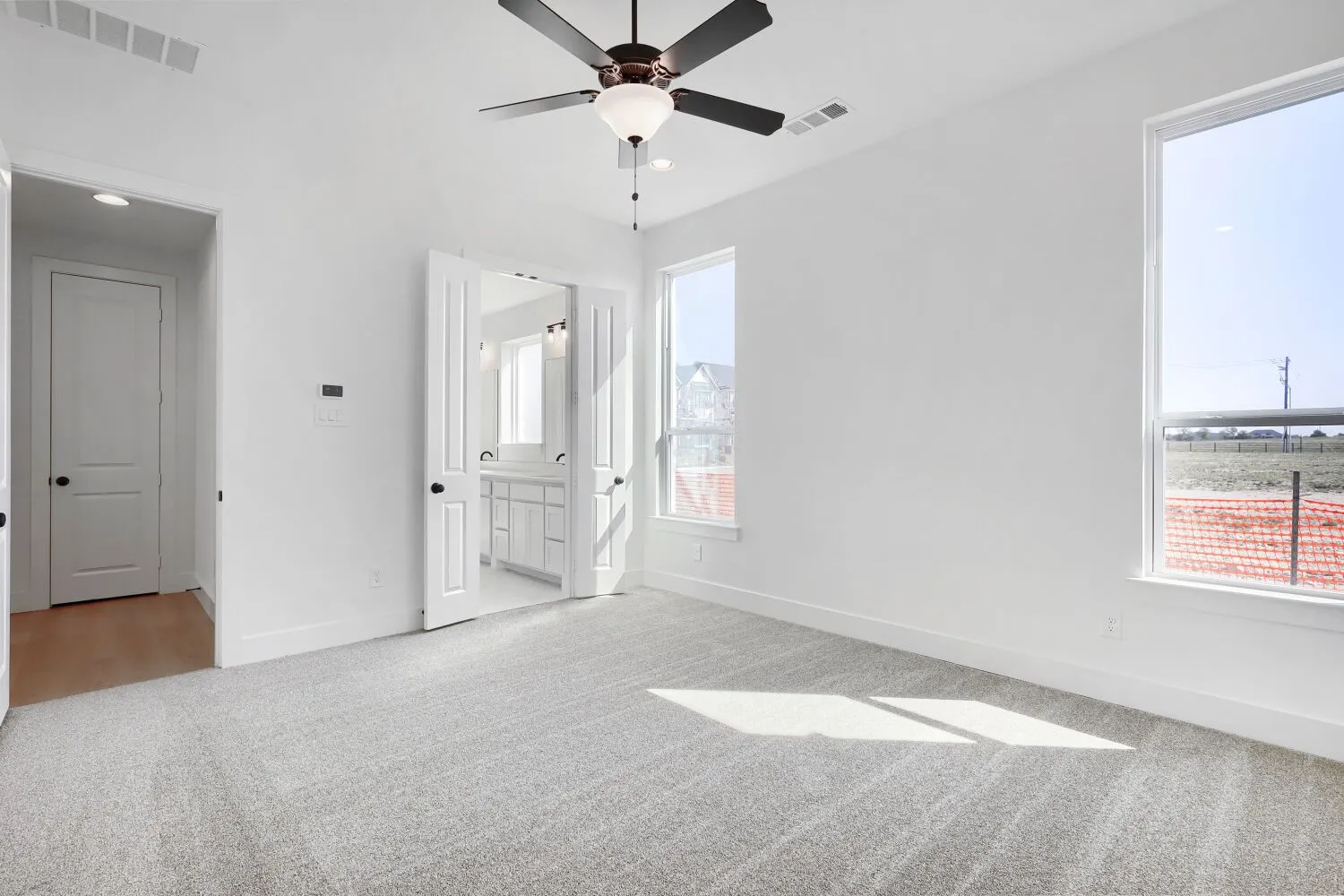 Recessed lighting, ceiling fan, carpeting, double-door entry, and dual windows