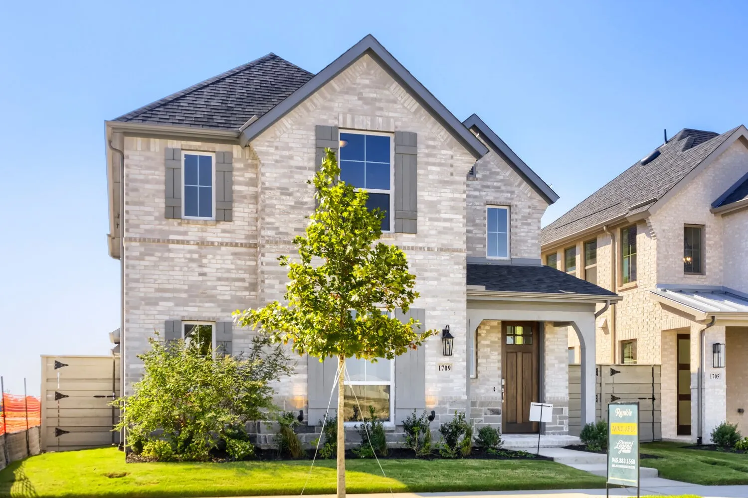 Contemporary stone exterior with multiple gabled rooflines and architectural depth