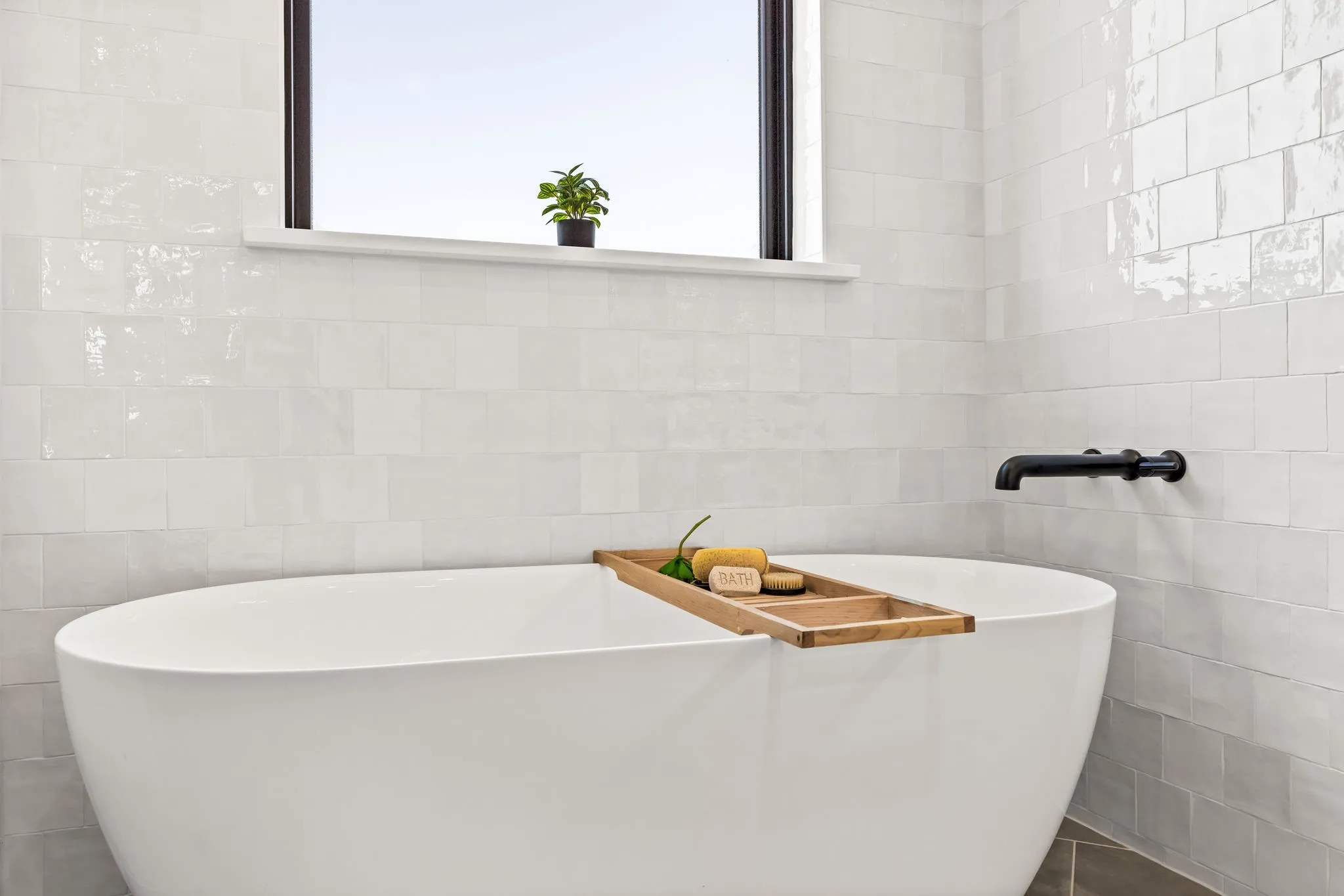 Elegant Freestanding Tub with Chandelier Above