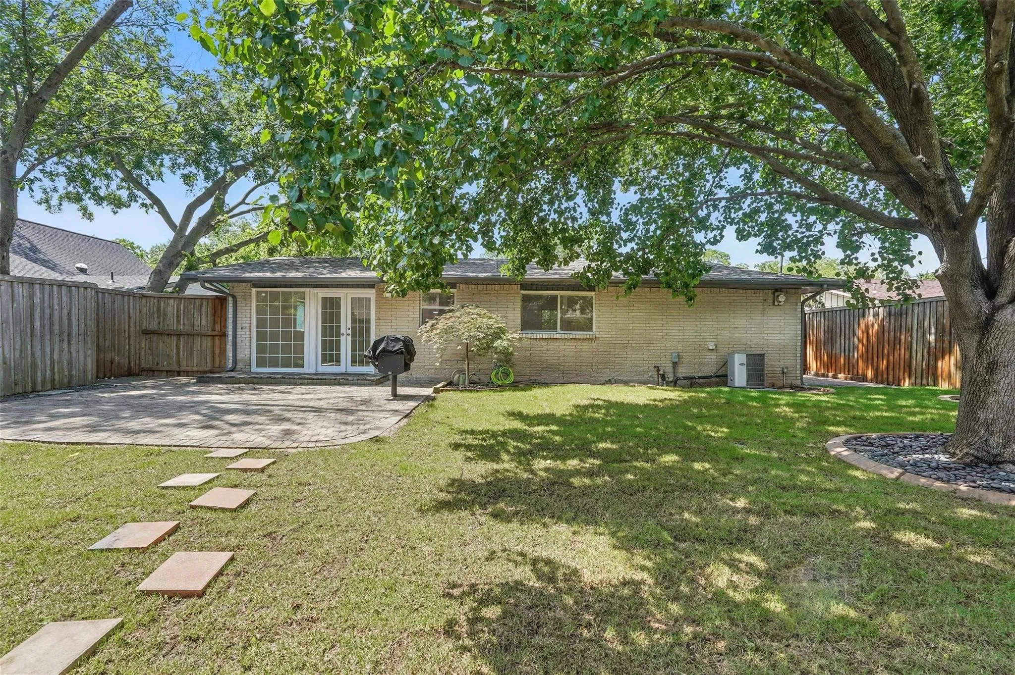 Large fenced yard with sprinkler system