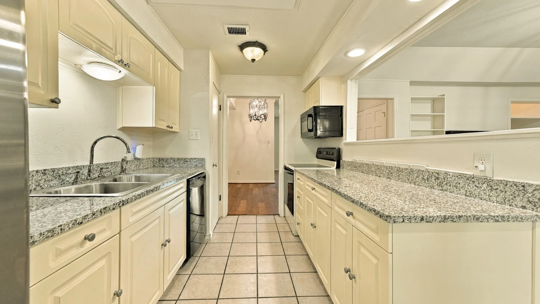 view of kitchen into den