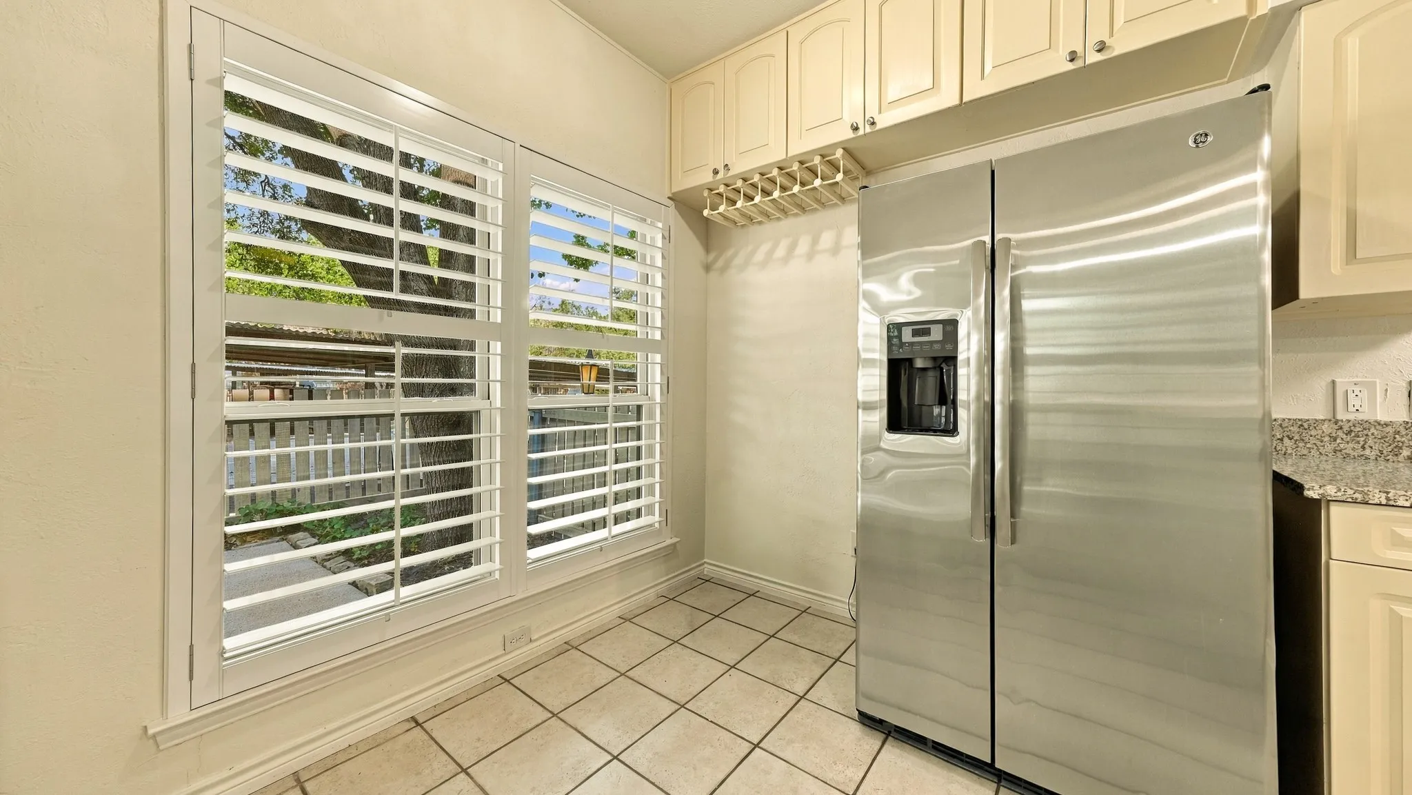 eat-in area, views of patio, greenbelt, Trinity Trails, creek, wine rack, refrigerator fits snug in place