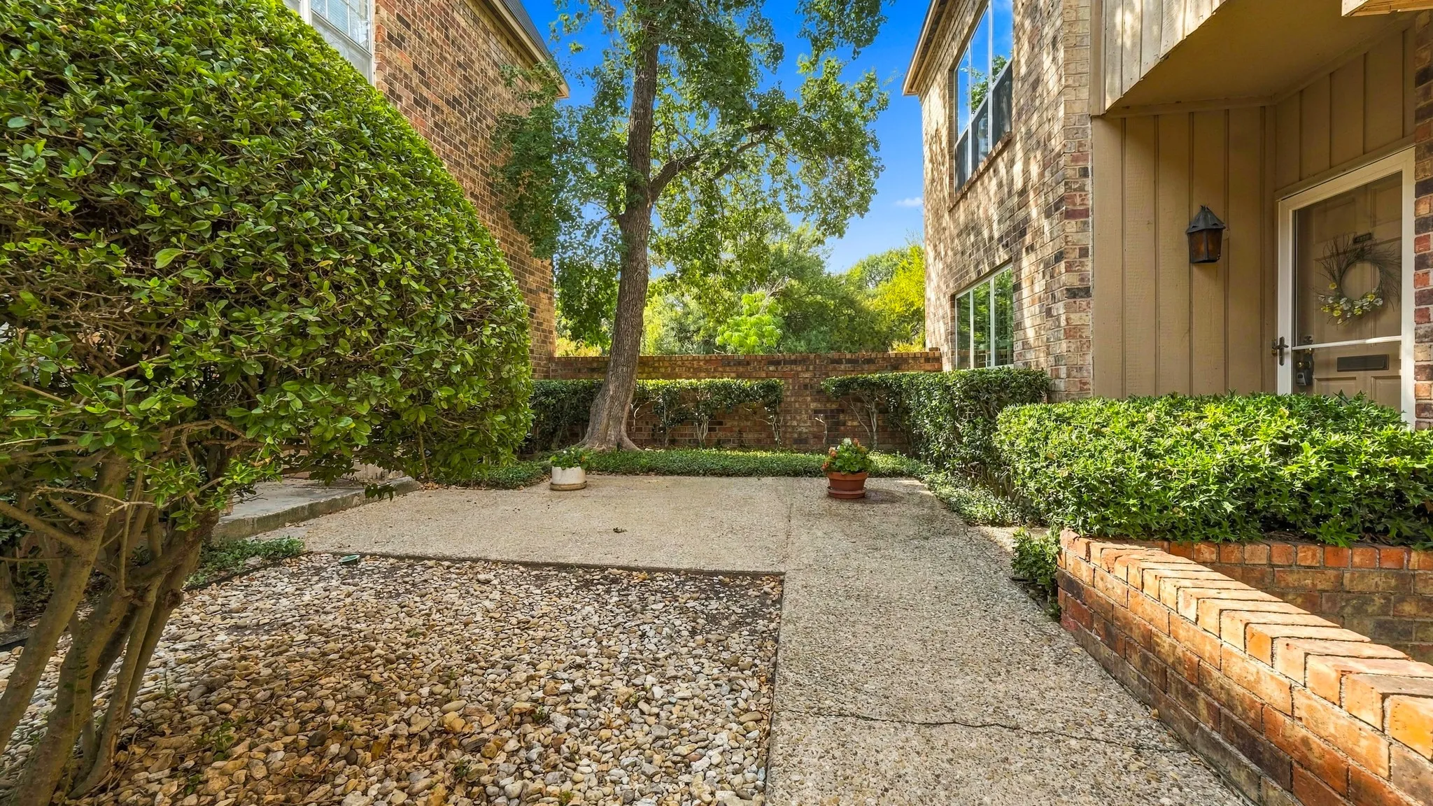 Walk way up to front door from Bellaire, last condo on right