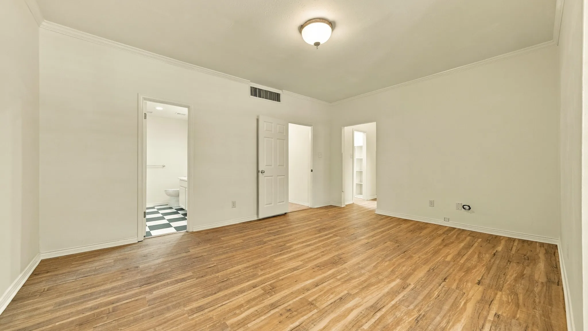 newer luxury vinyl wood flooring, high ceilings, crown molding