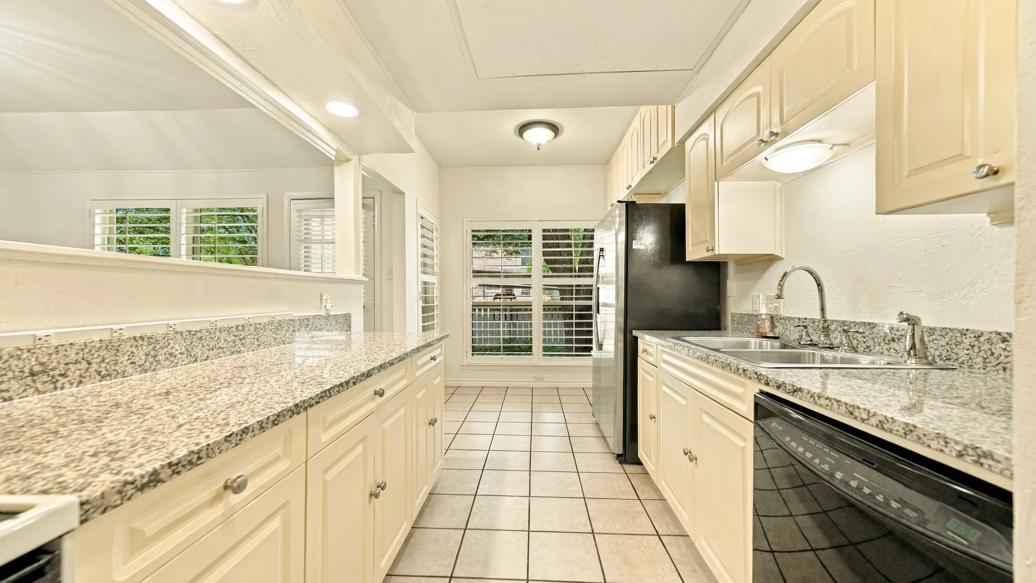 kitchen granite and eat in area by windows