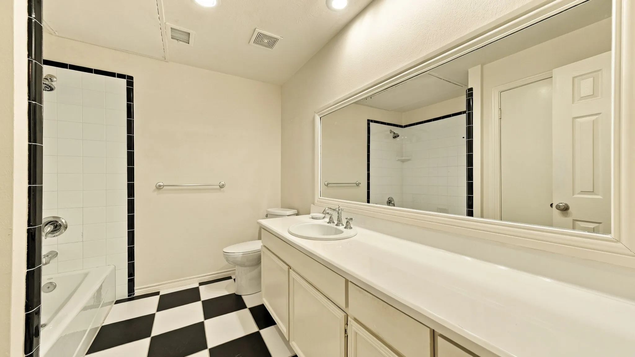 large roomy with long mirror & closet behind door